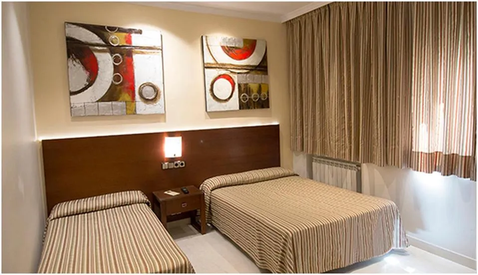 Bed in Hostal Atocha Almudena Martín