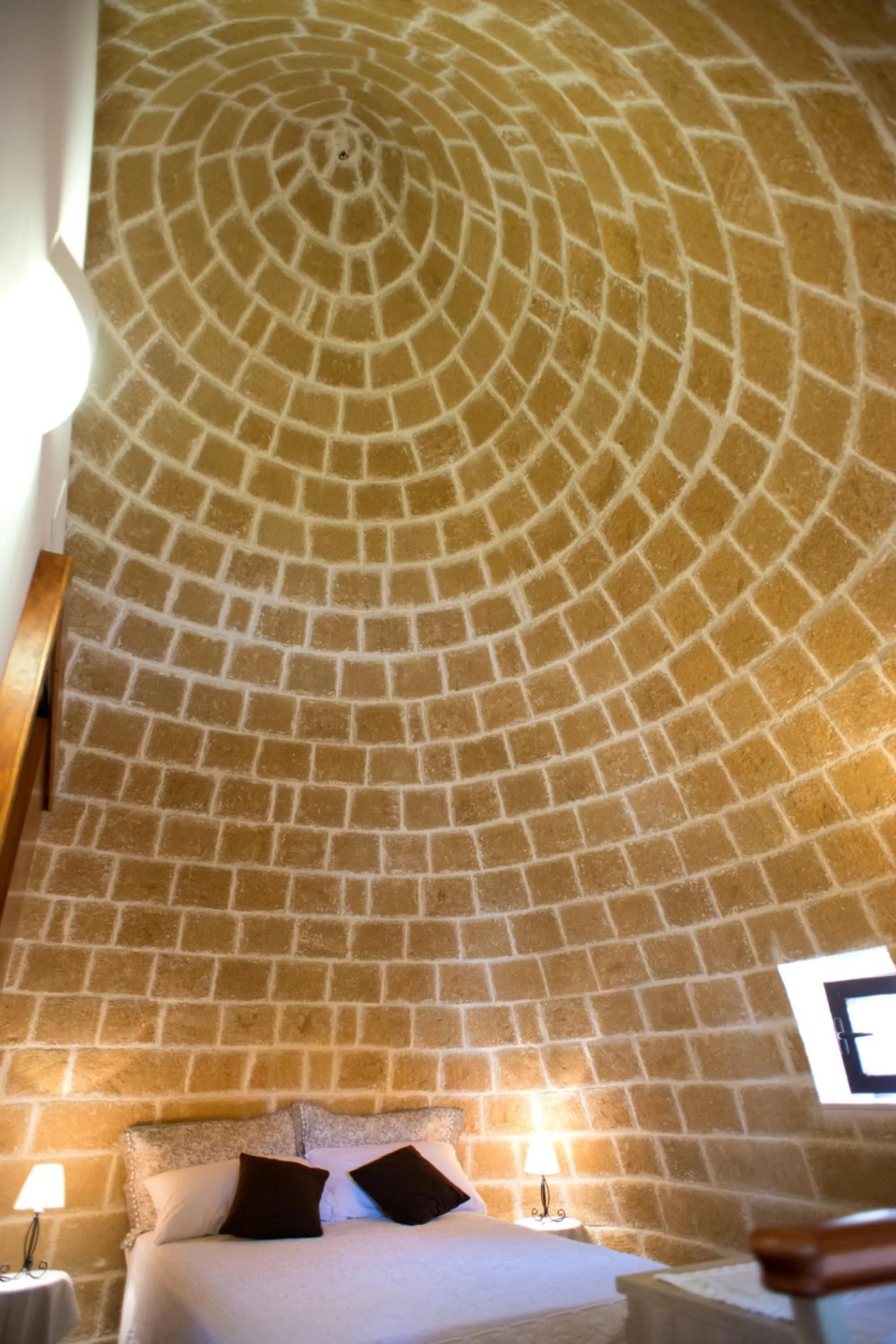 Bed in Grandi Trulli Bed & Breakfast