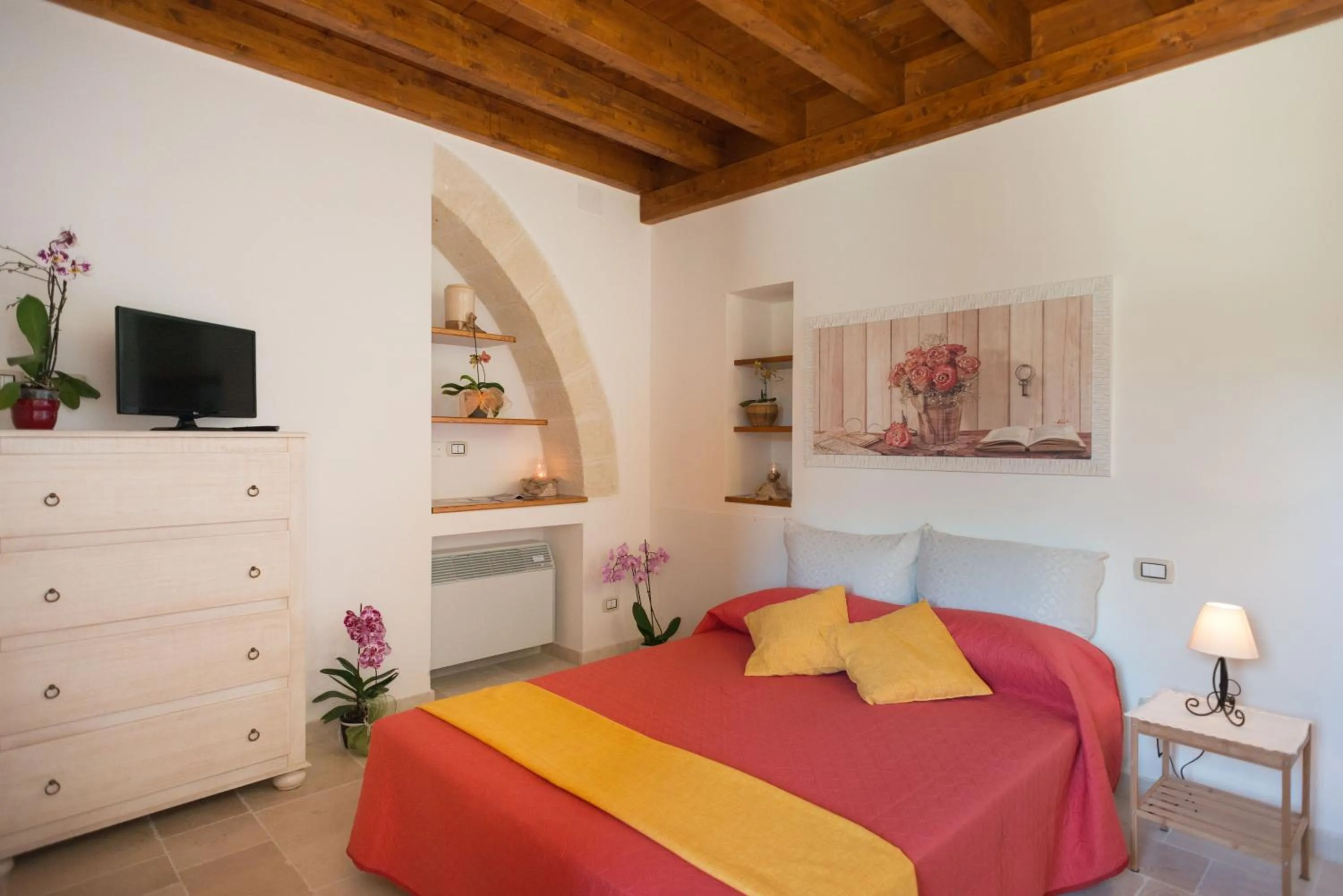 Bed in Grandi Trulli Bed & Breakfast