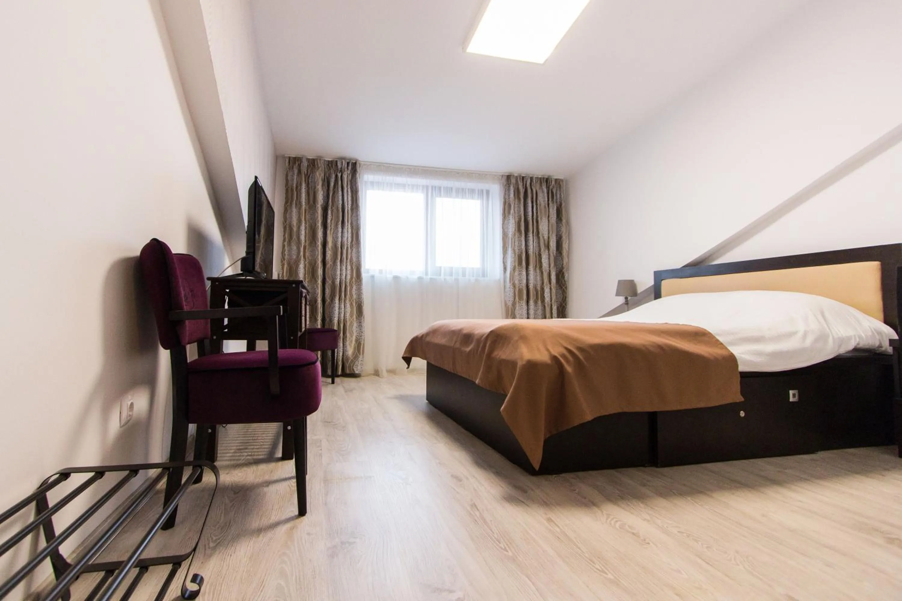 Bed in Hotel Evianne Boutique