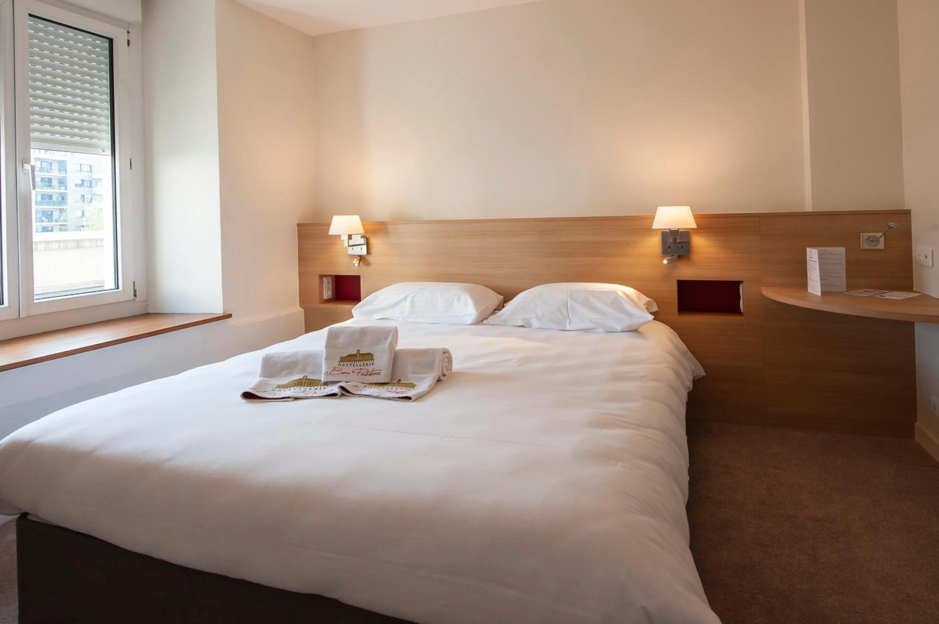 Bed in Hostellerie Bon Pasteur