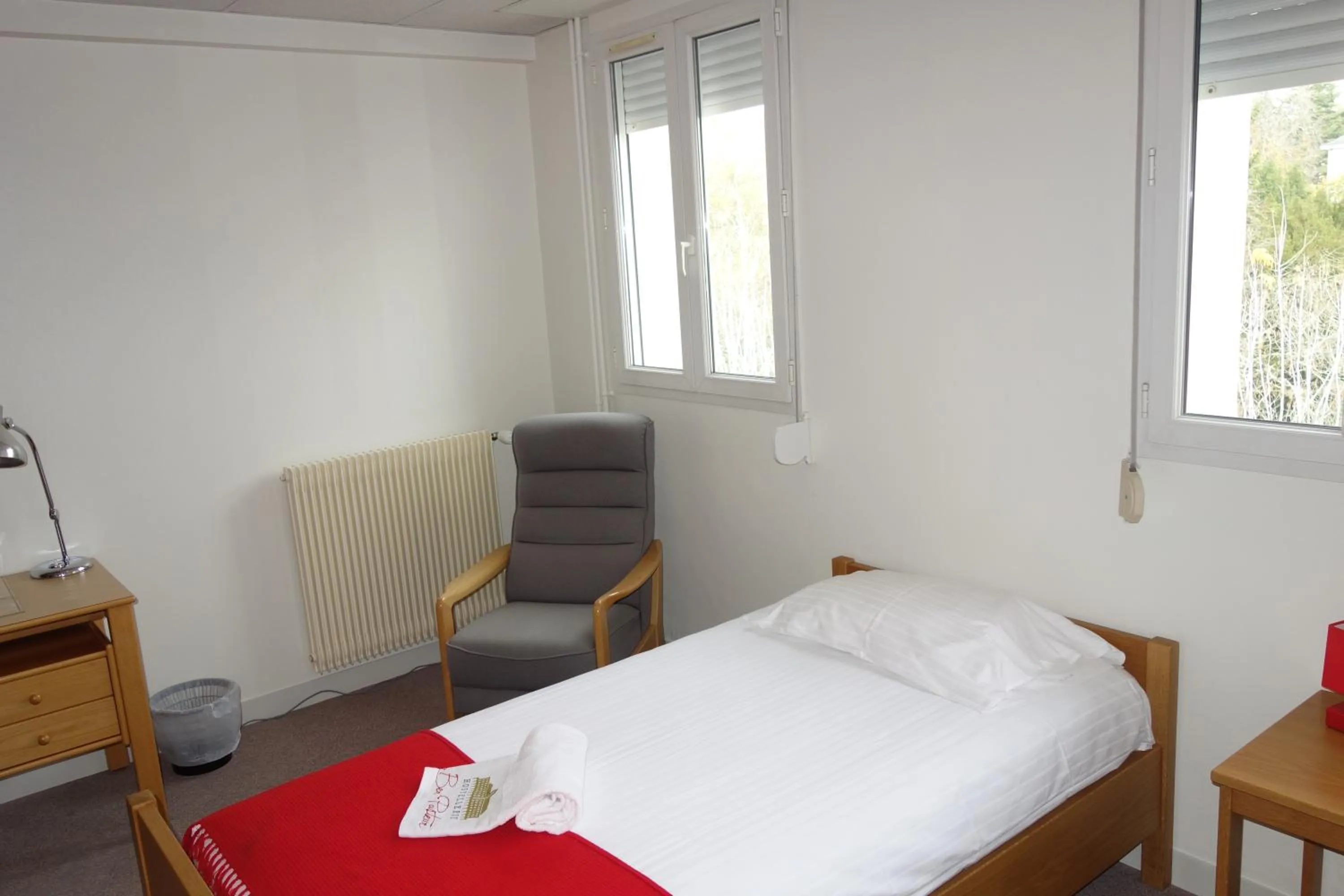 Bed in Hostellerie Bon Pasteur