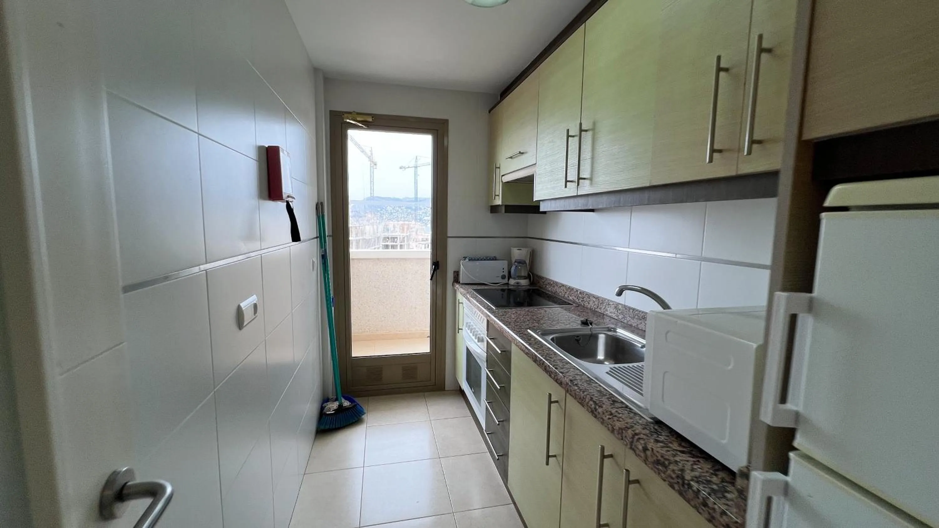 Kitchen or kitchenette in Apartamentos Larimar Unitursa