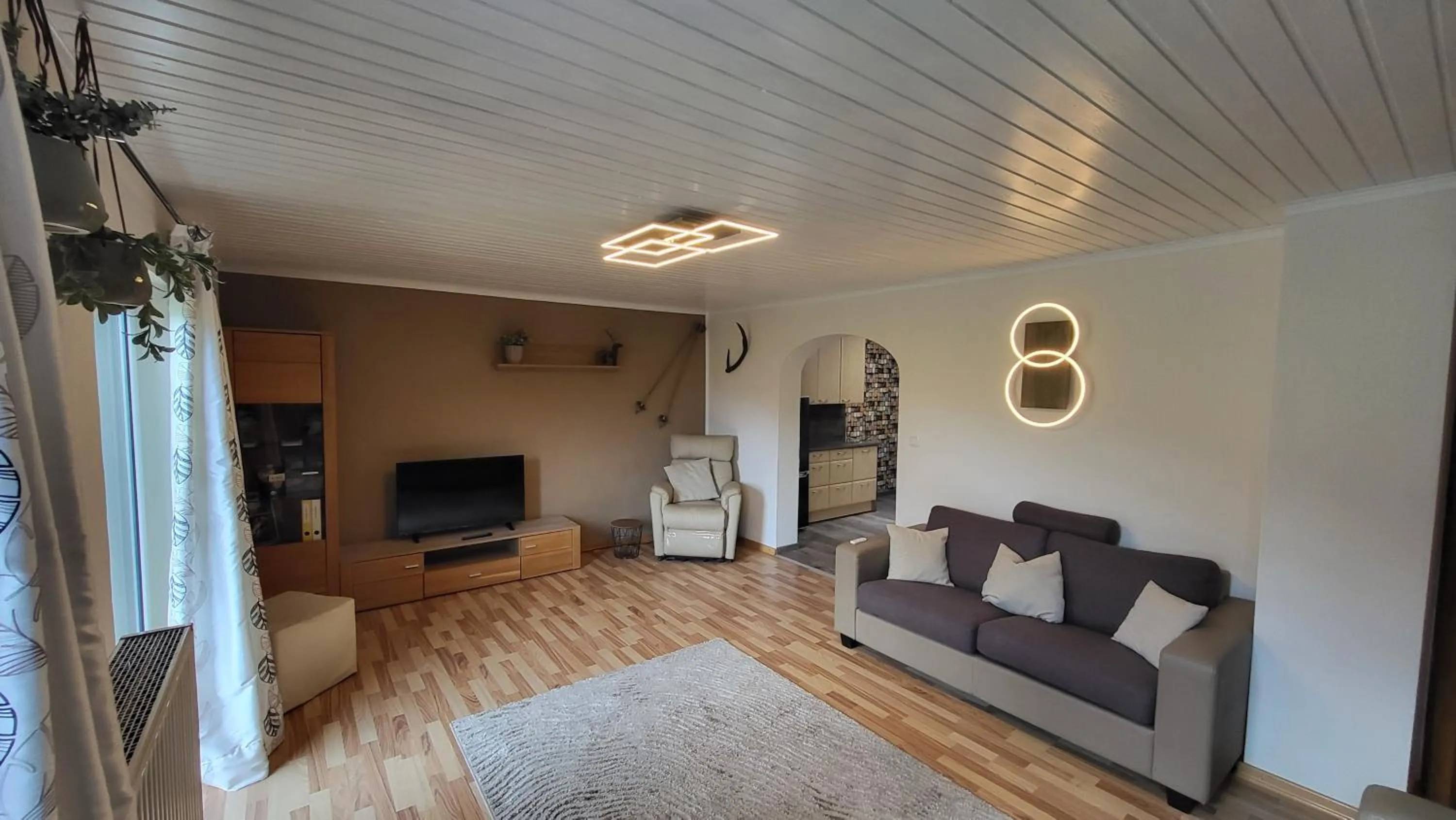 Communal lounge/ TV room in Alpenzeit Apartments