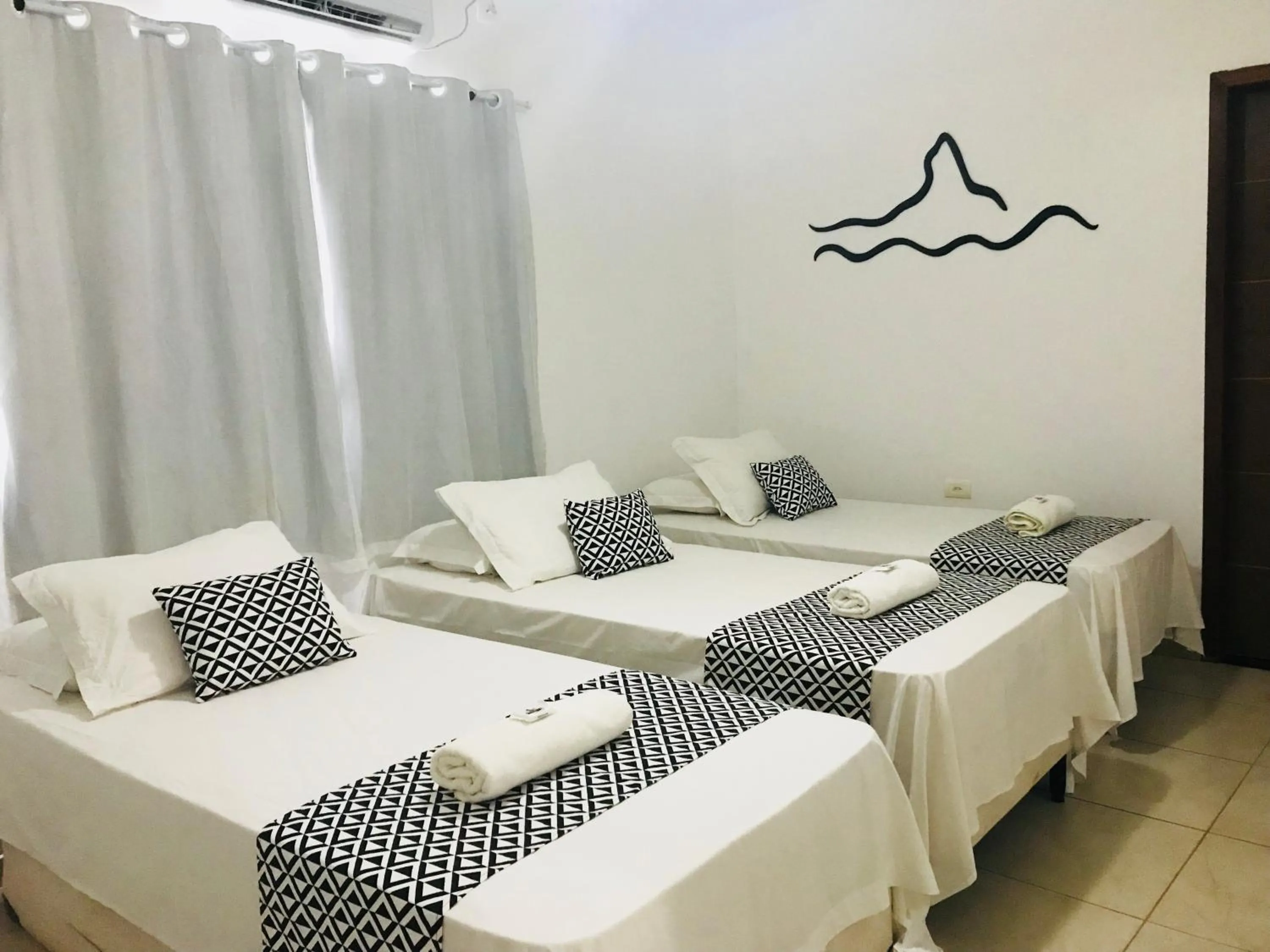 Bed in Pousada Morro do Pico