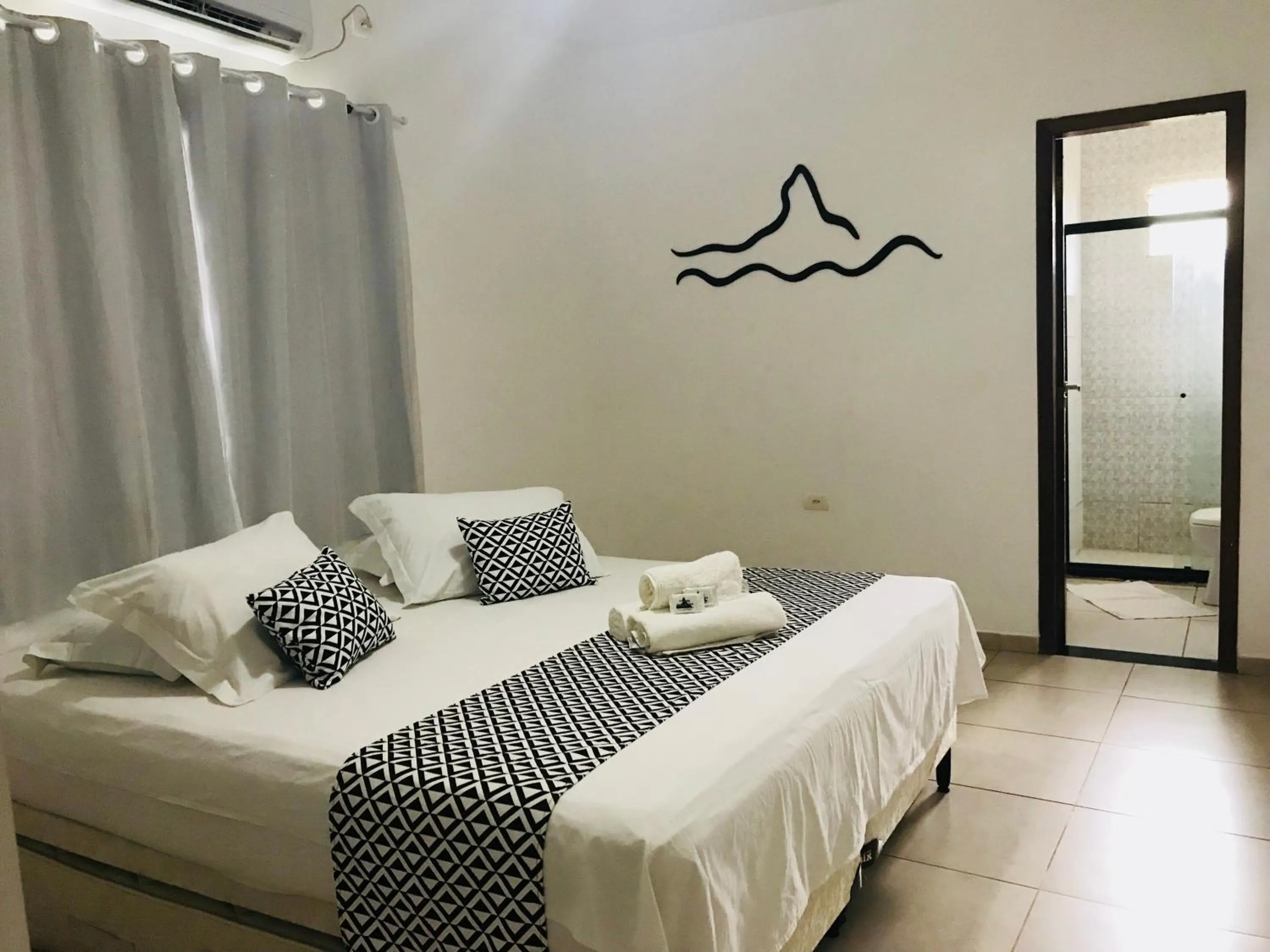 Bed in Pousada Morro do Pico