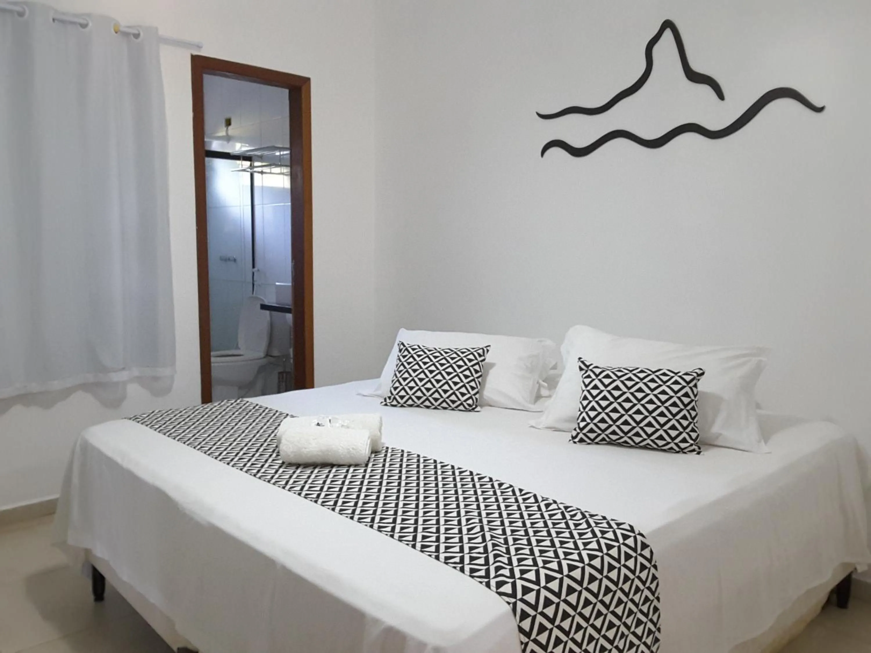 Bed in Pousada Morro do Pico