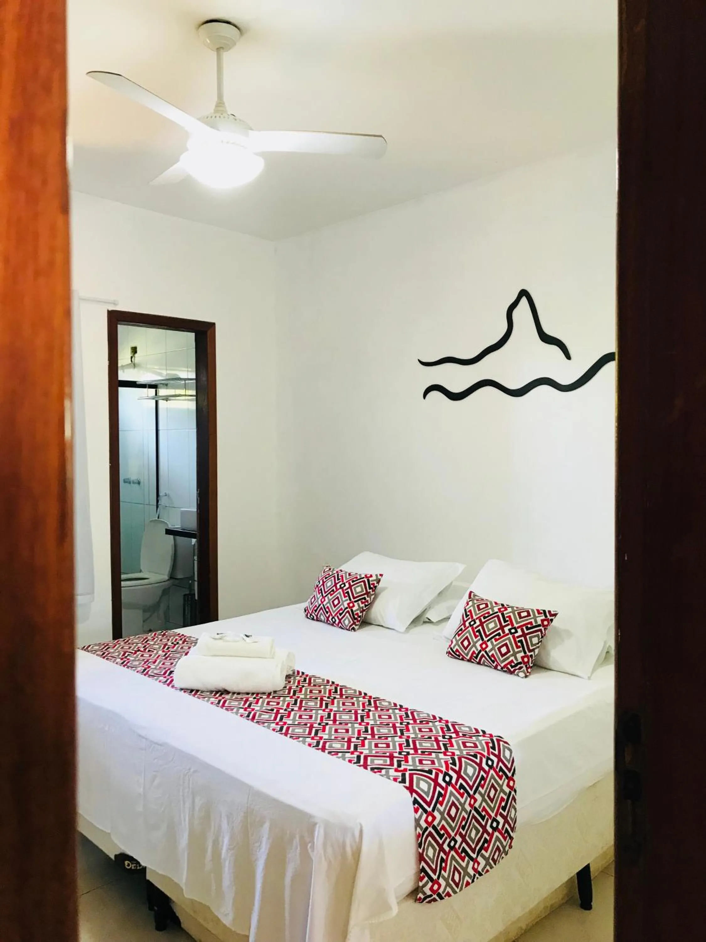 Bed in Pousada Morro do Pico