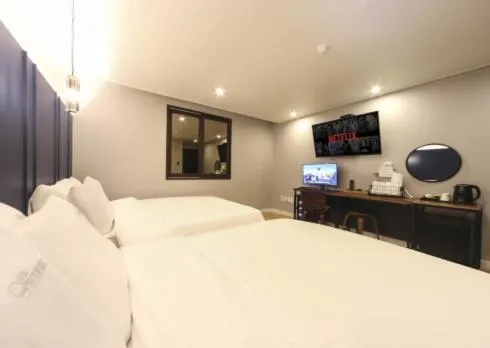 Bed in The Stone Bridge Hotel Sasang