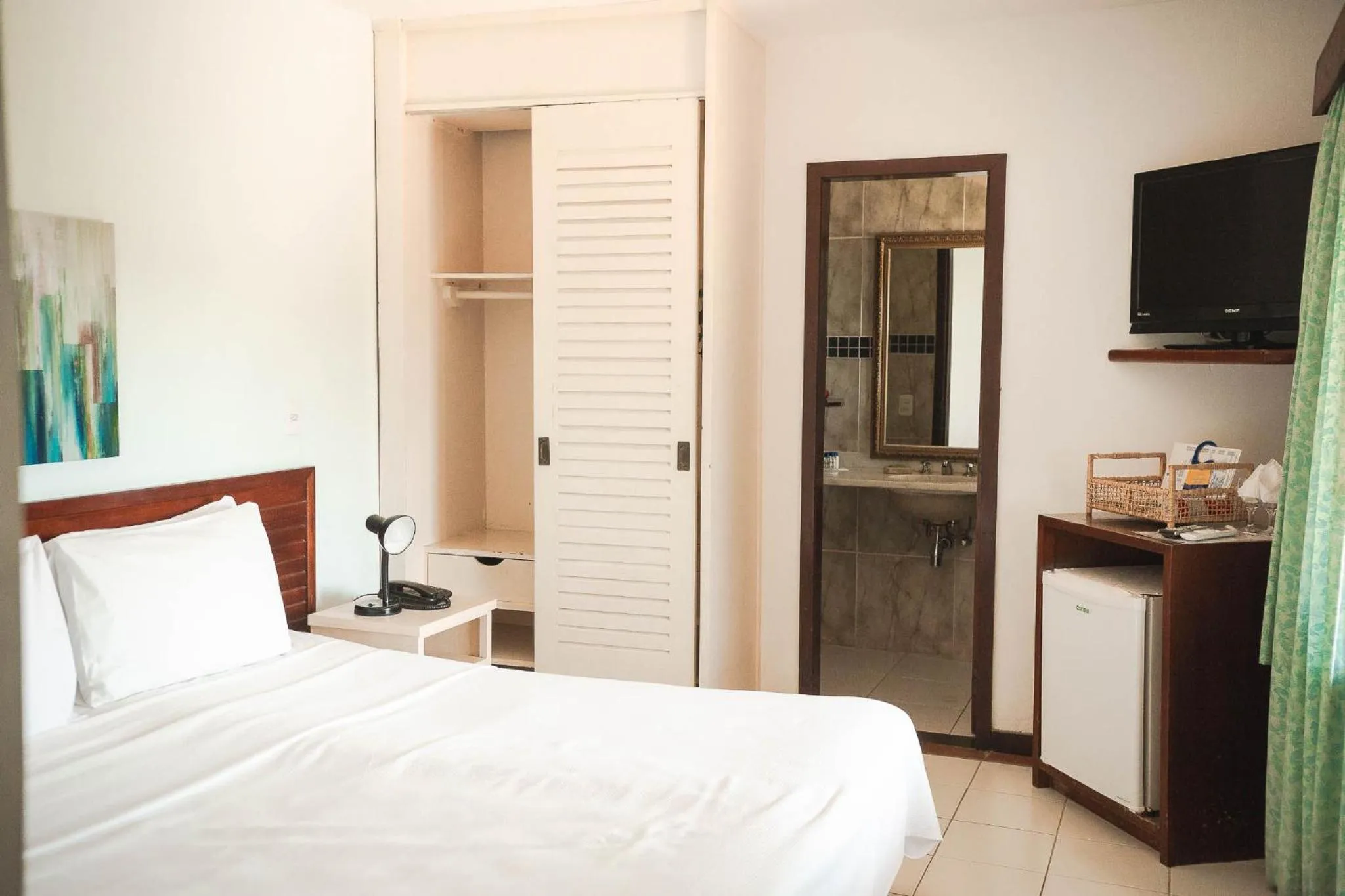 Bed in Colonna Galapagos Garden Hotel