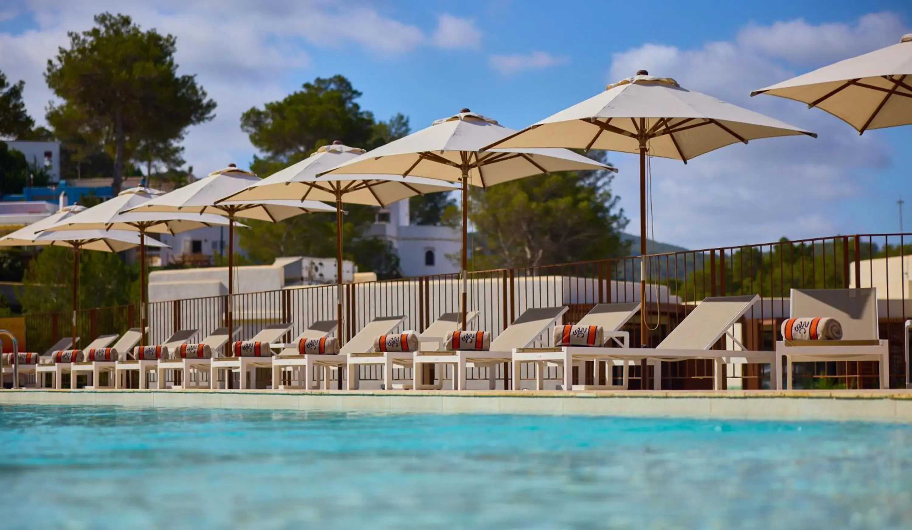 Swimming pool in Cala San Miguel Hotel Ibiza, Curio Collection by Hilton, Adults only Swimming pool in Cala San Miguel Hotel Ibiza, Curio Collection by Hilton, Adults only