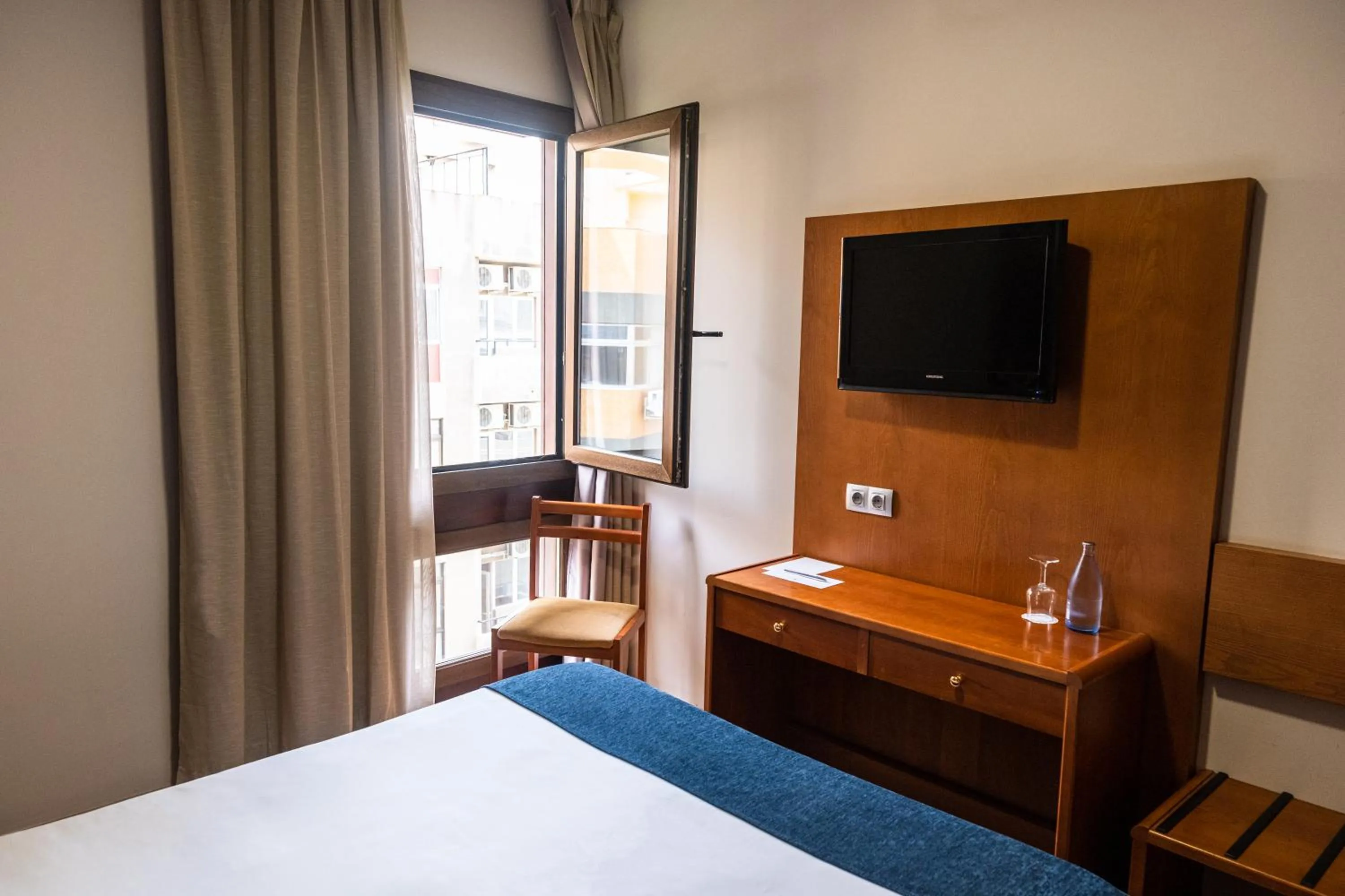 Bed in Hotel Adonis Plaza