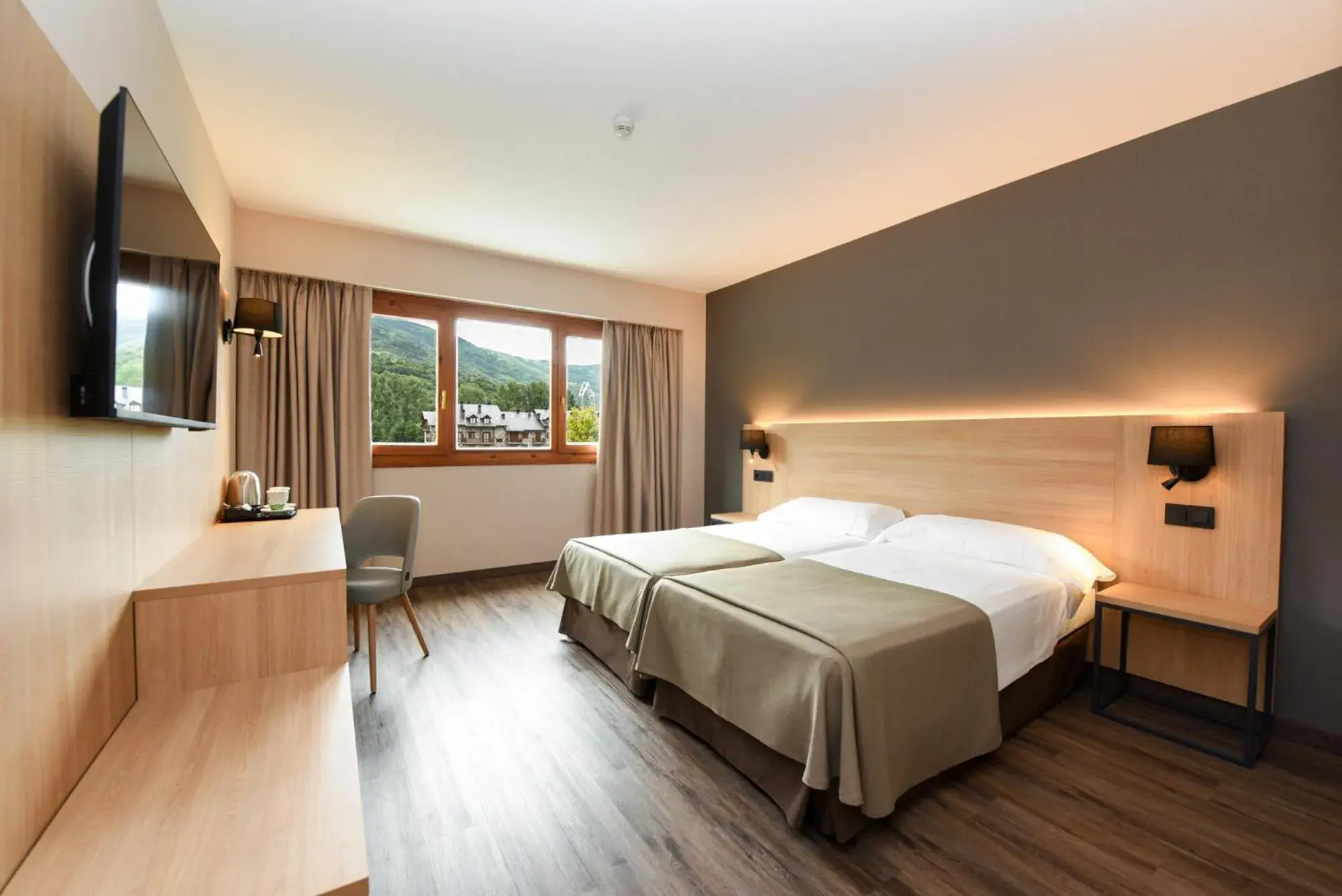 Bed in SOMMOS Hotel Benasque Spa Bed in SOMMOS Hotel Benasque Spa