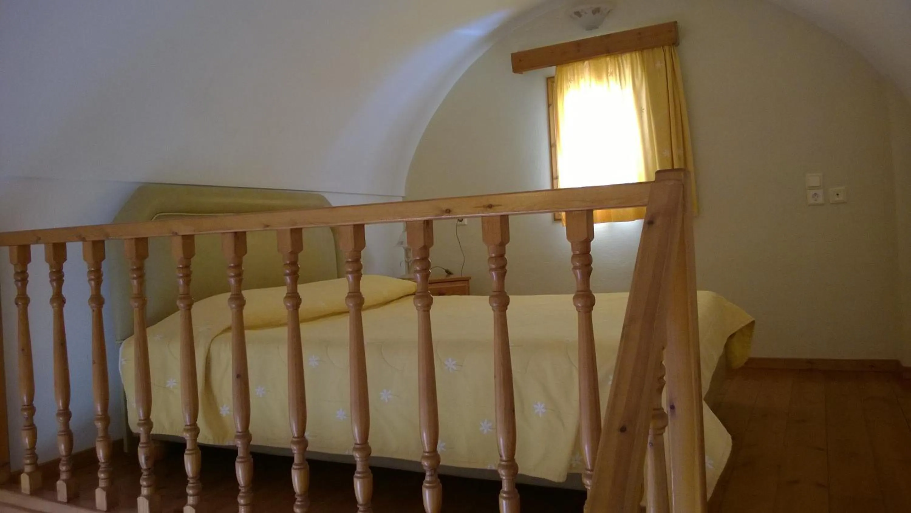 Bed in Anemomilos Suites