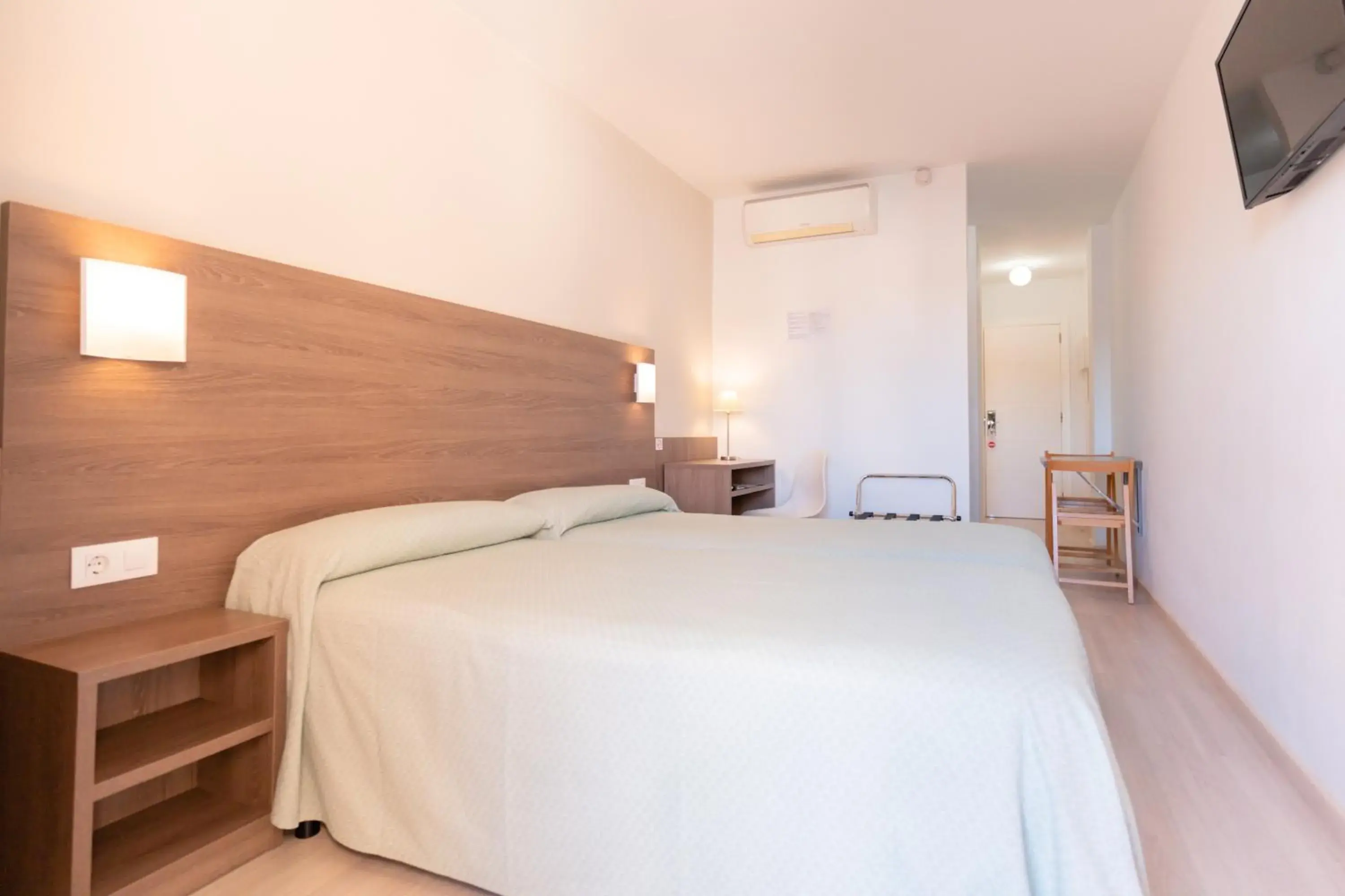 Bed in Apartamentos Loar Bed in Apartamentos Loar