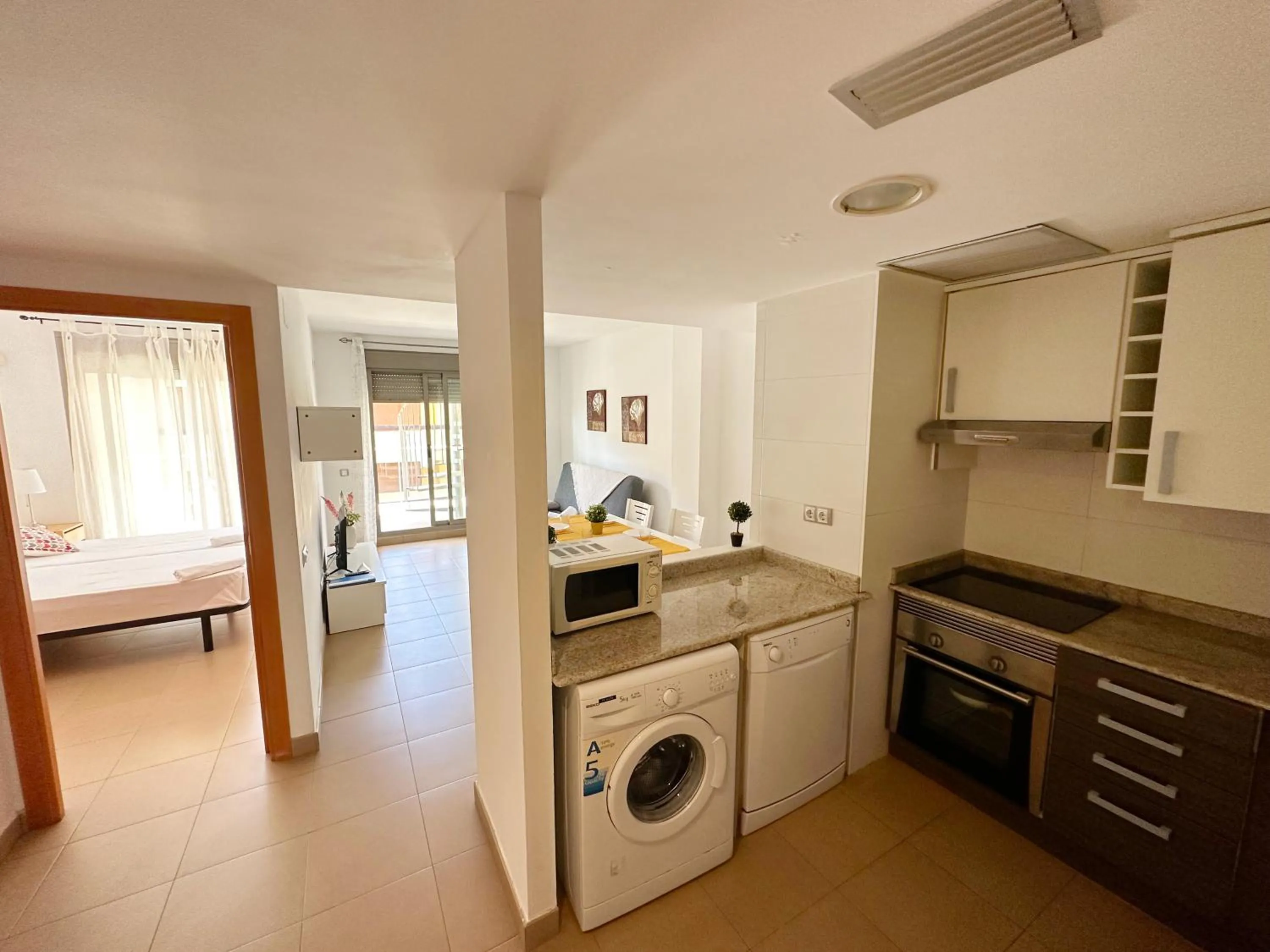 Kitchen or kitchenette in Apartamentos Alcocebre Suites 3000