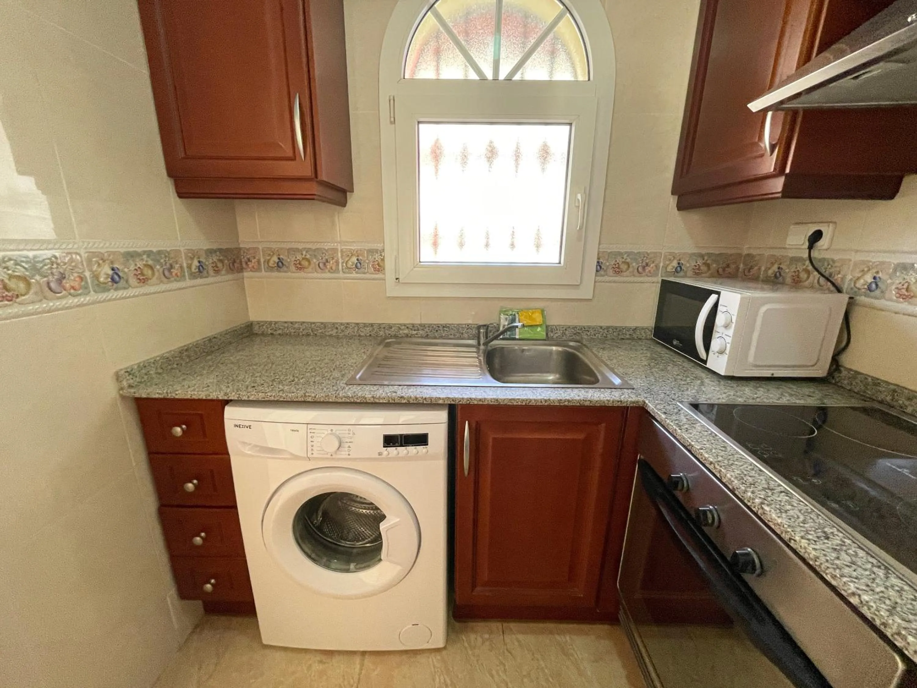 Kitchen or kitchenette in Apartamentos Madeira 3000