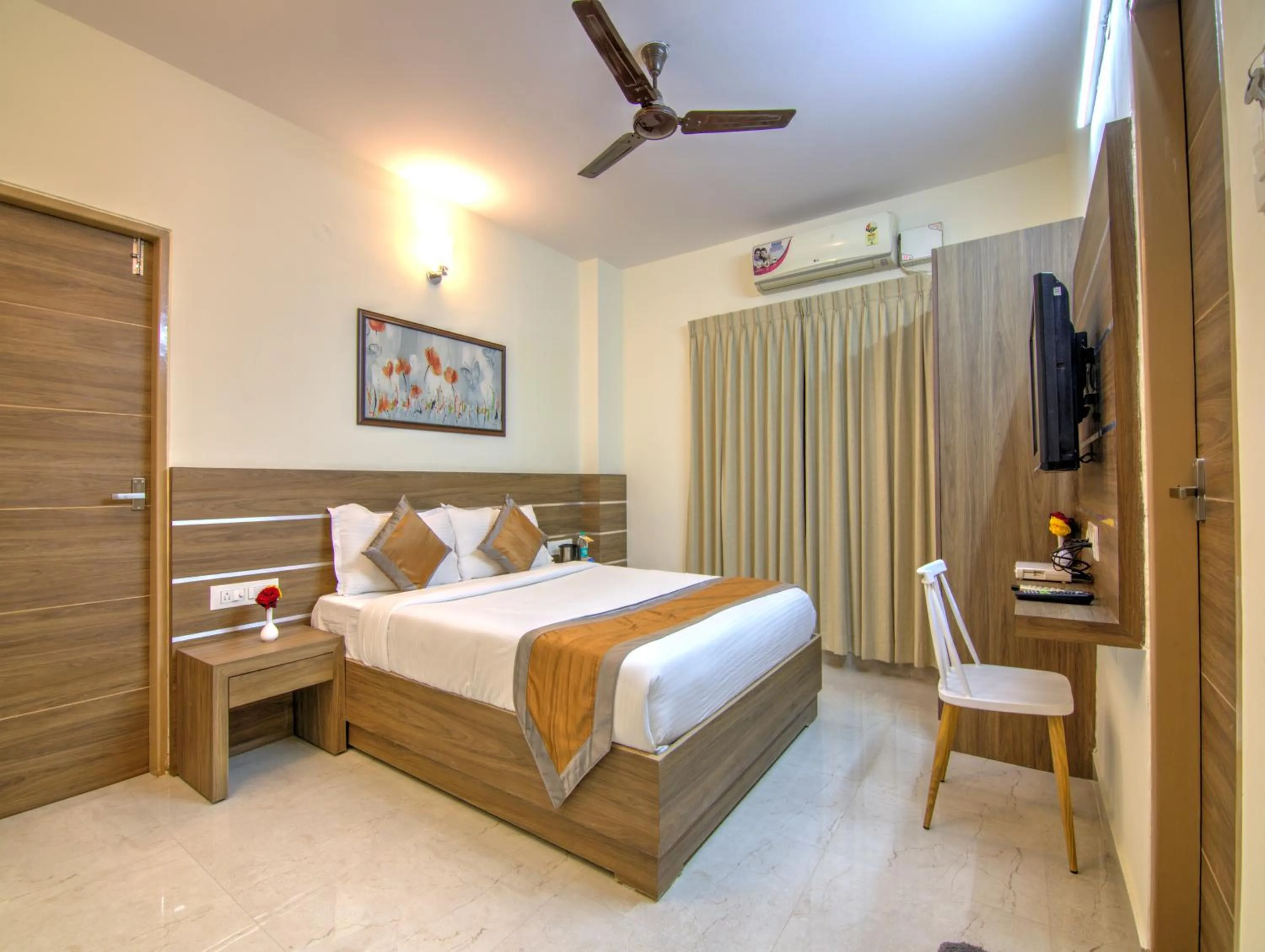 Bed in Sunshine Suites Grand Deluxe