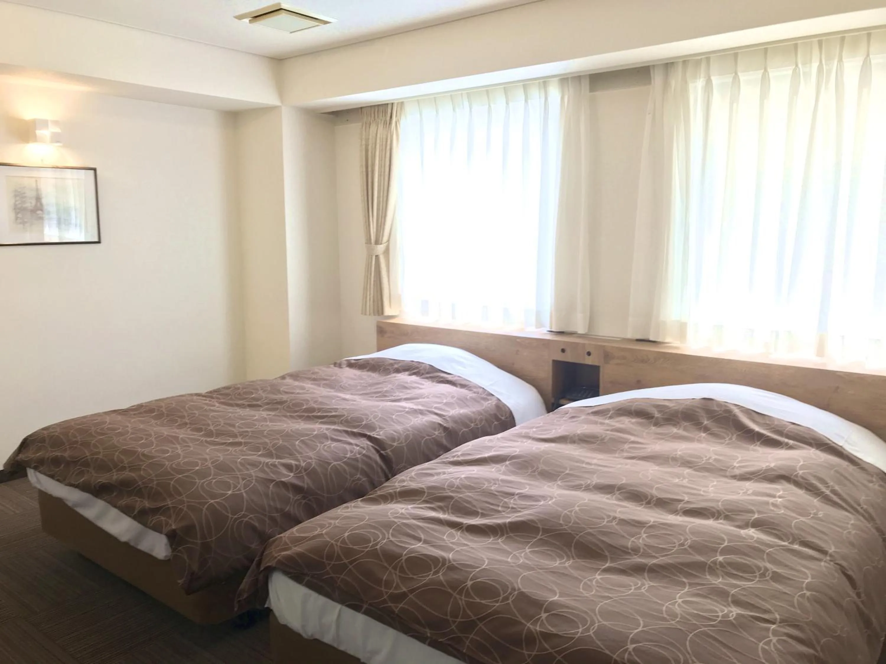 Bed in Ichinomiya Green Hotel