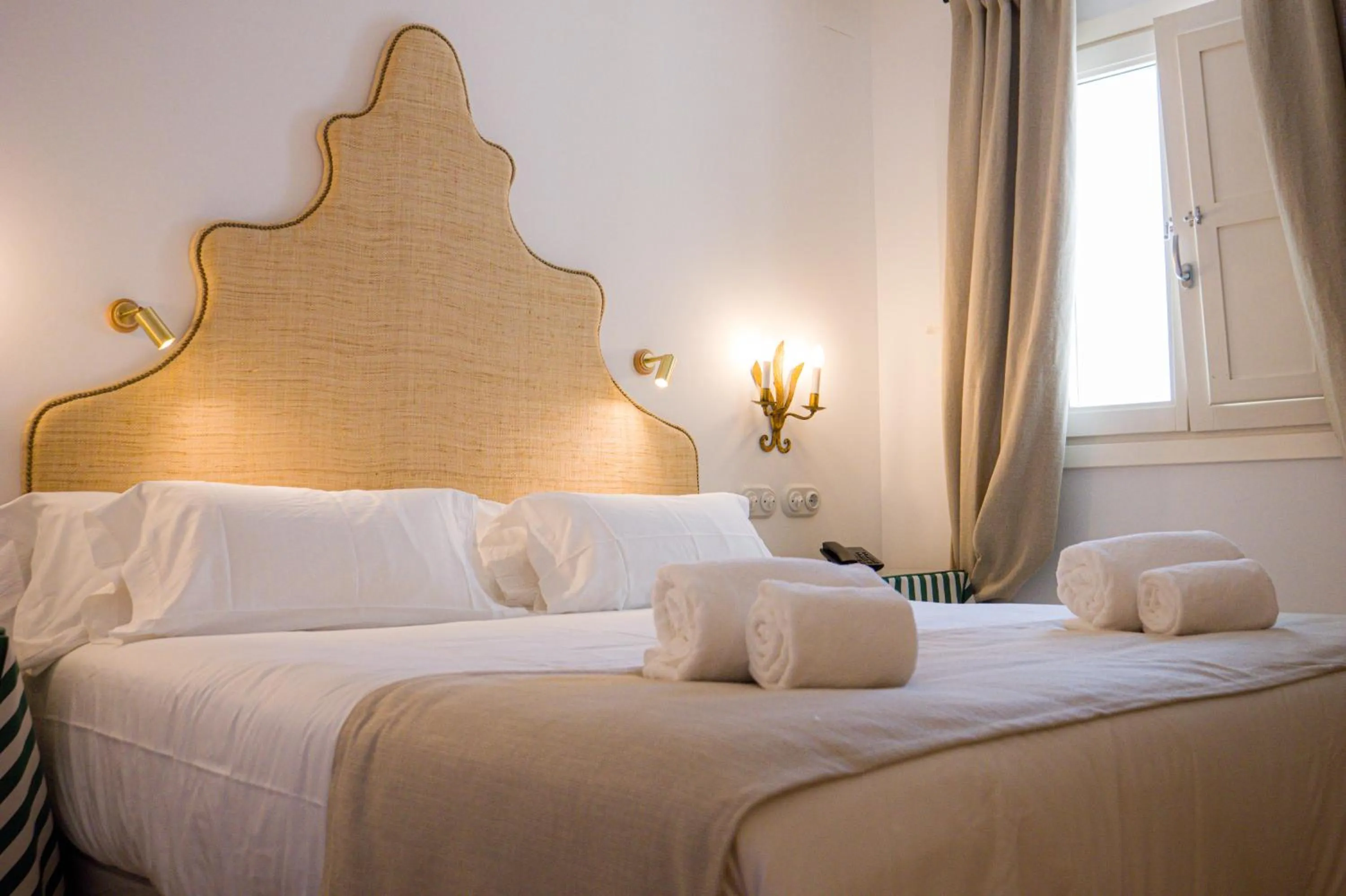 Bed in Casa Pizarro Hotel