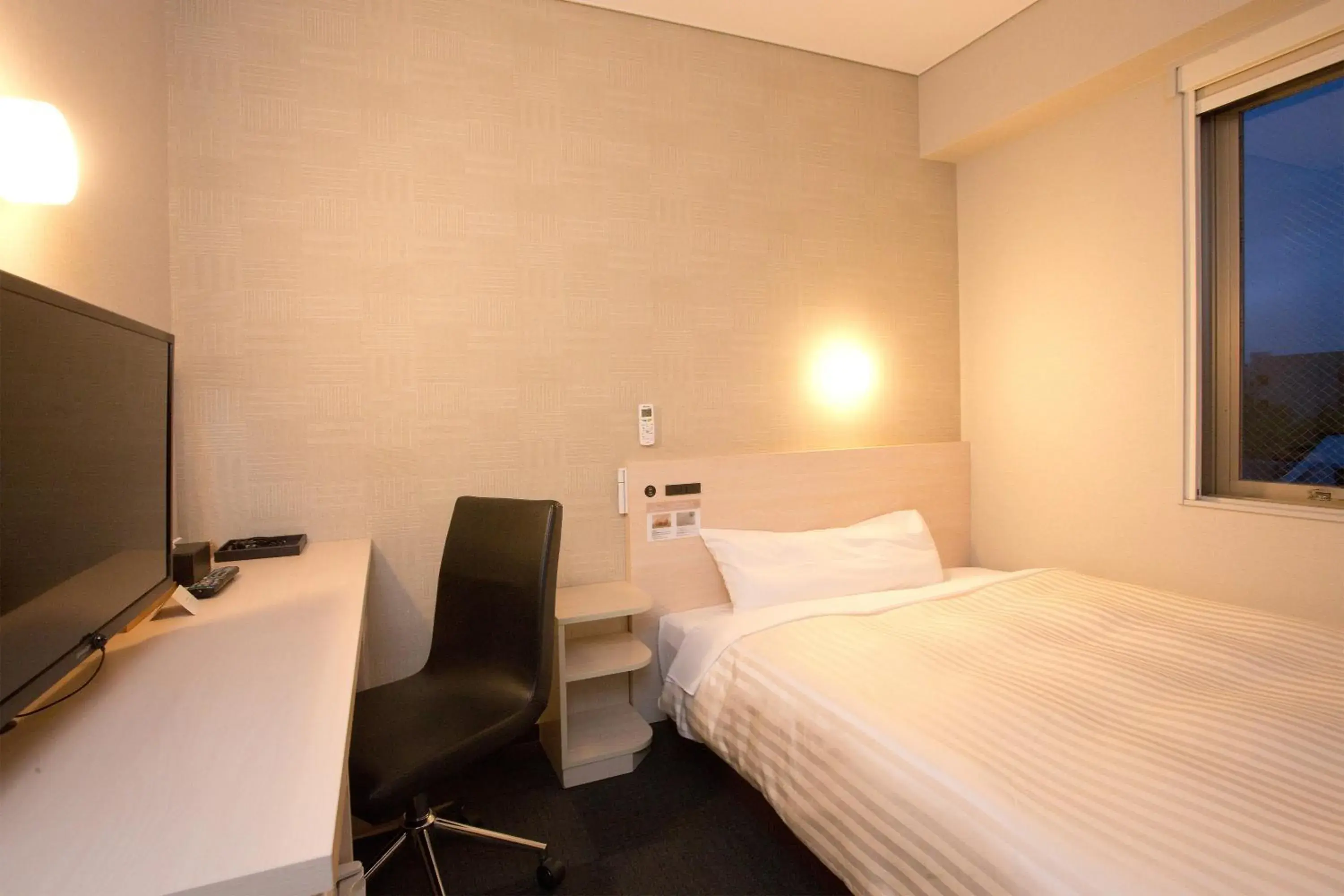 Bed in Super Hotel Miyazaki Natural Hot Springs Bed in Super Hotel Miyazaki Natural Hot Springs