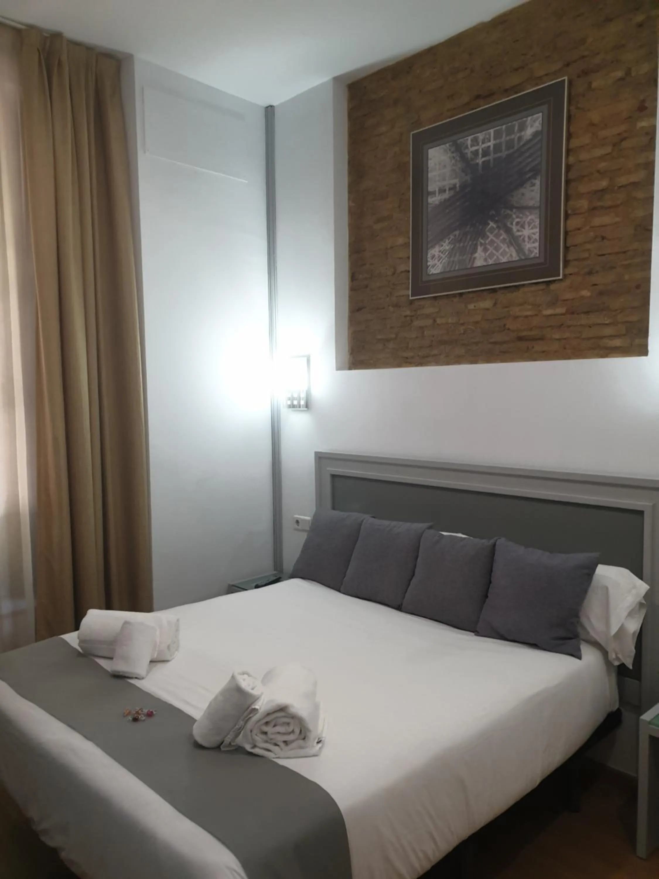 Bed in Hotel y Apartamentos Doña Lola