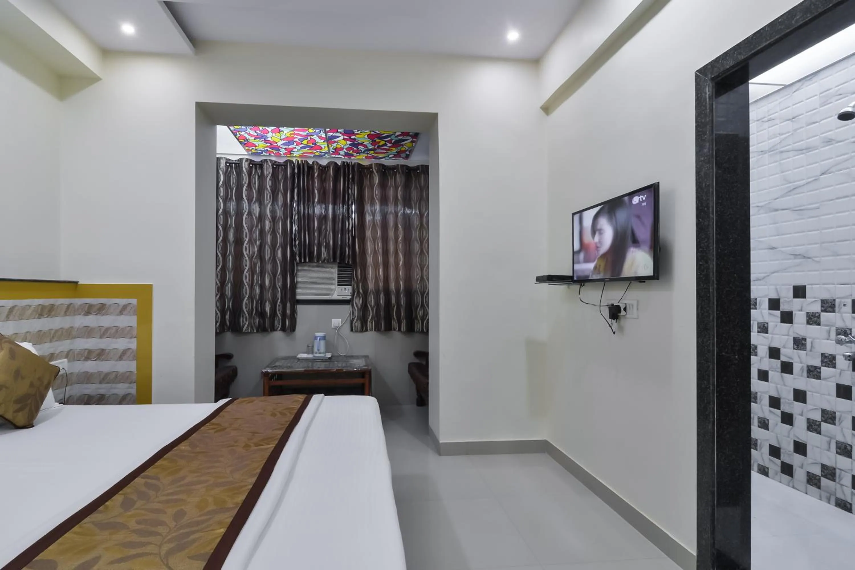 Photo of the whole room, Bed in Hotel Aroma- Dadar