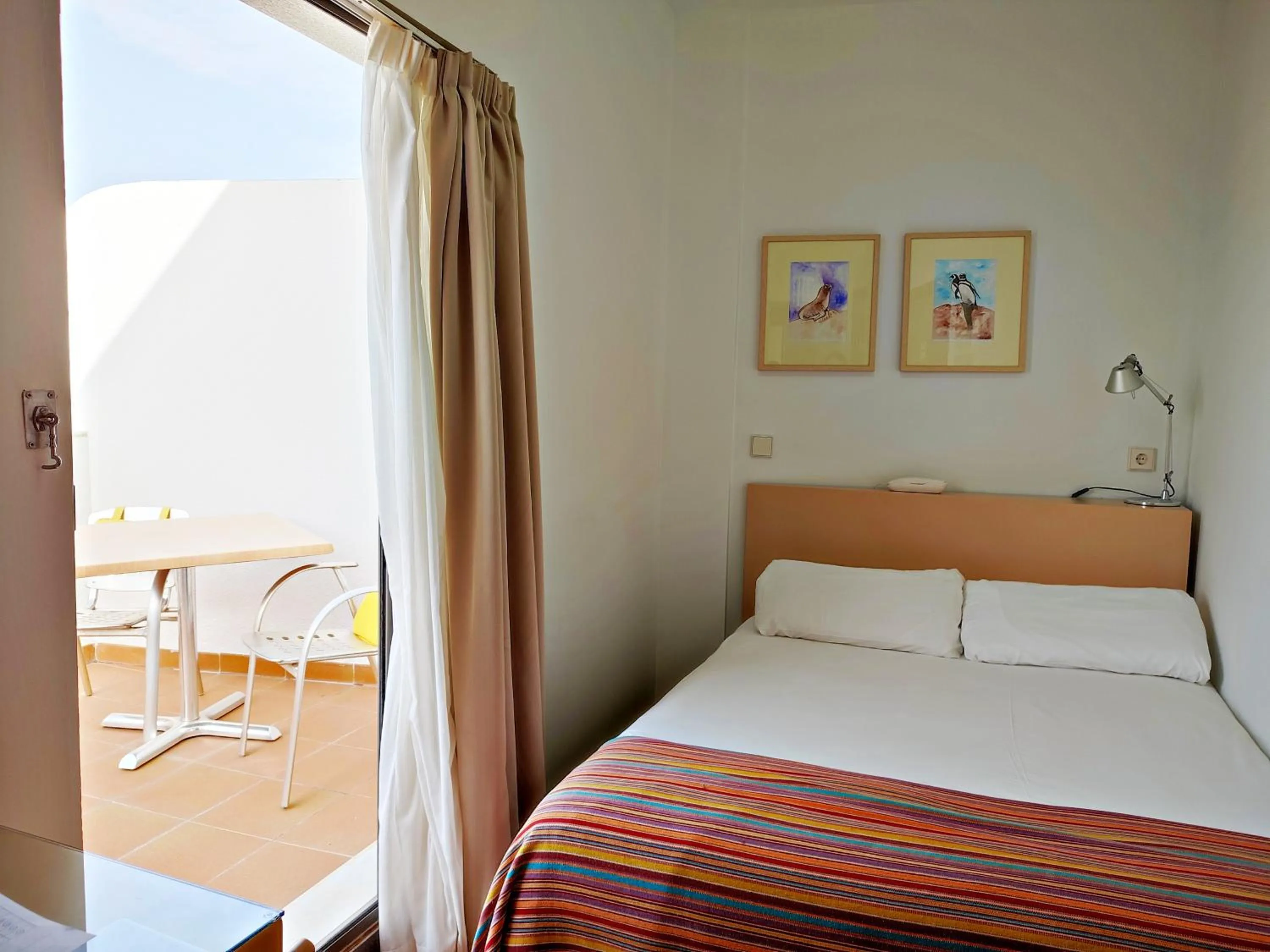 Bed in Hotel Apartamentos Patagonia Sur