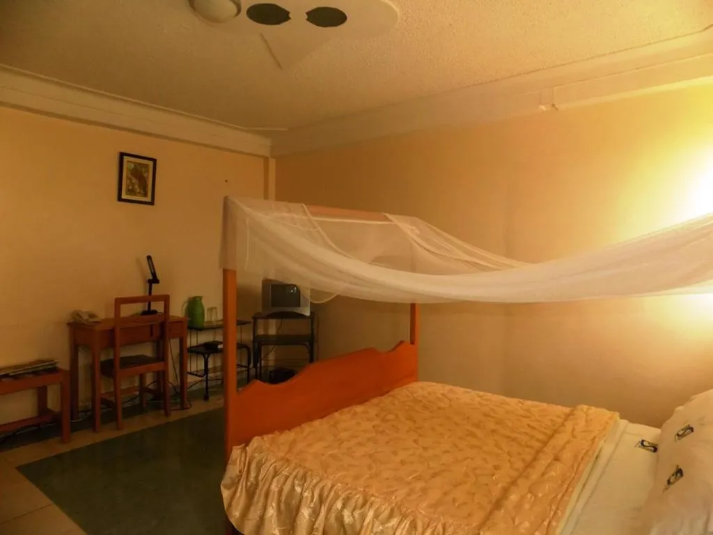 Bed in Palm Springs Hotel Masaka