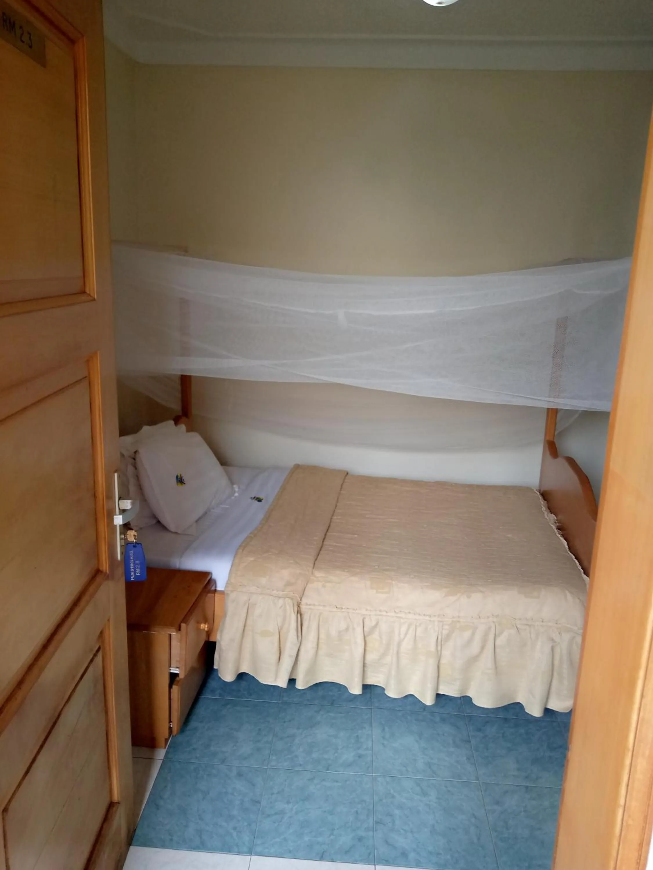 Bed in Palm Springs Hotel Masaka