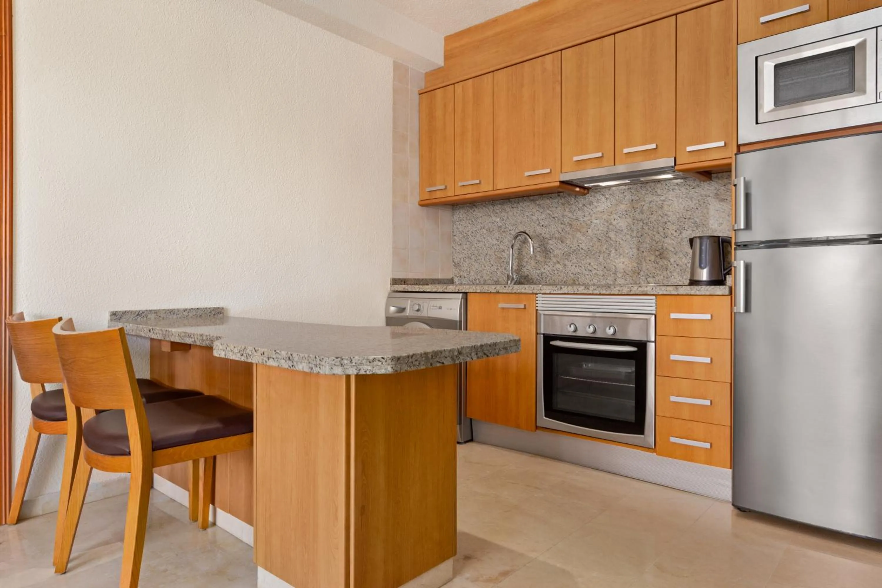 kitchen in Ramada Hotel & Suites by Wyndham Costa del Sol