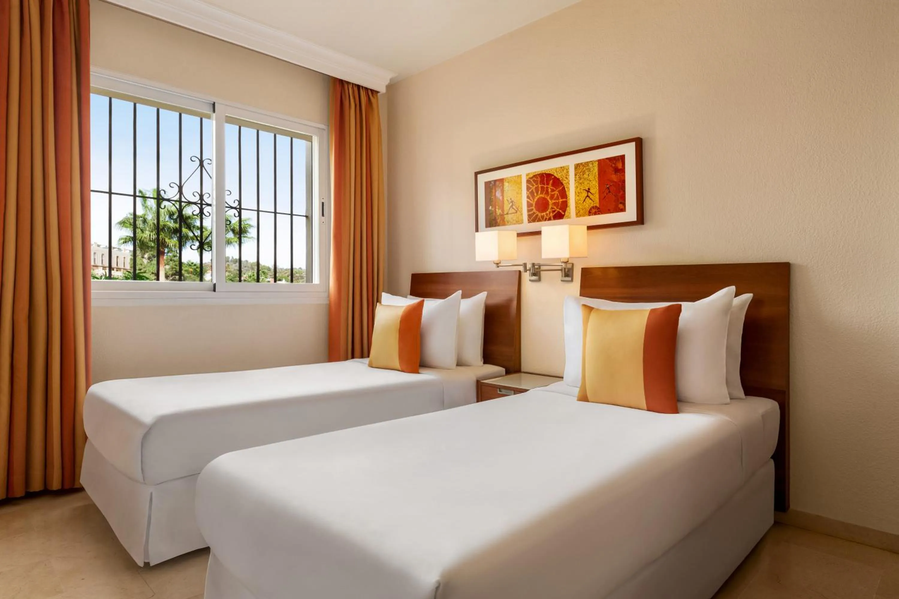 Bed in Ramada Hotel & Suites by Wyndham Costa del Sol