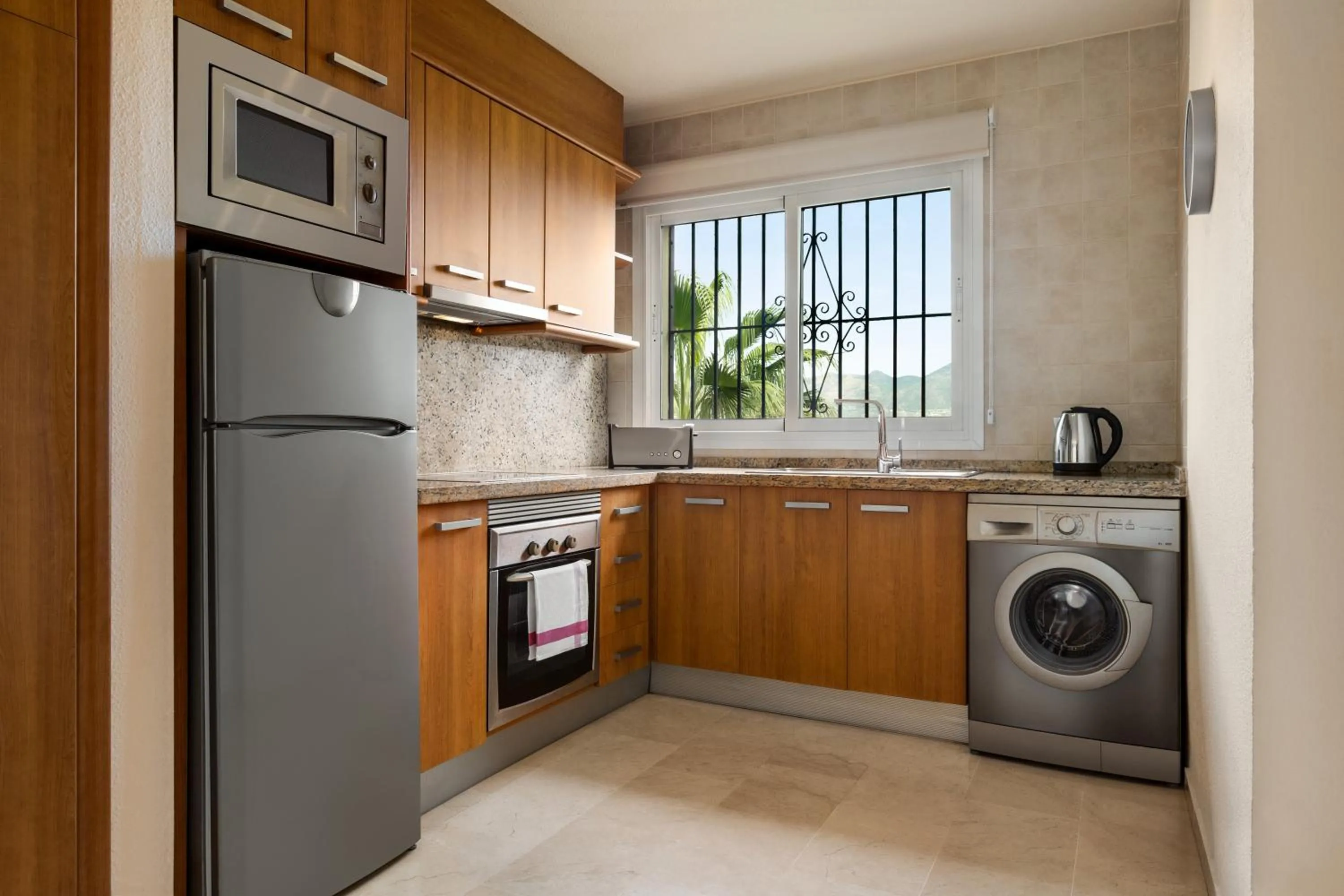 kitchen in Ramada Hotel & Suites by Wyndham Costa del Sol