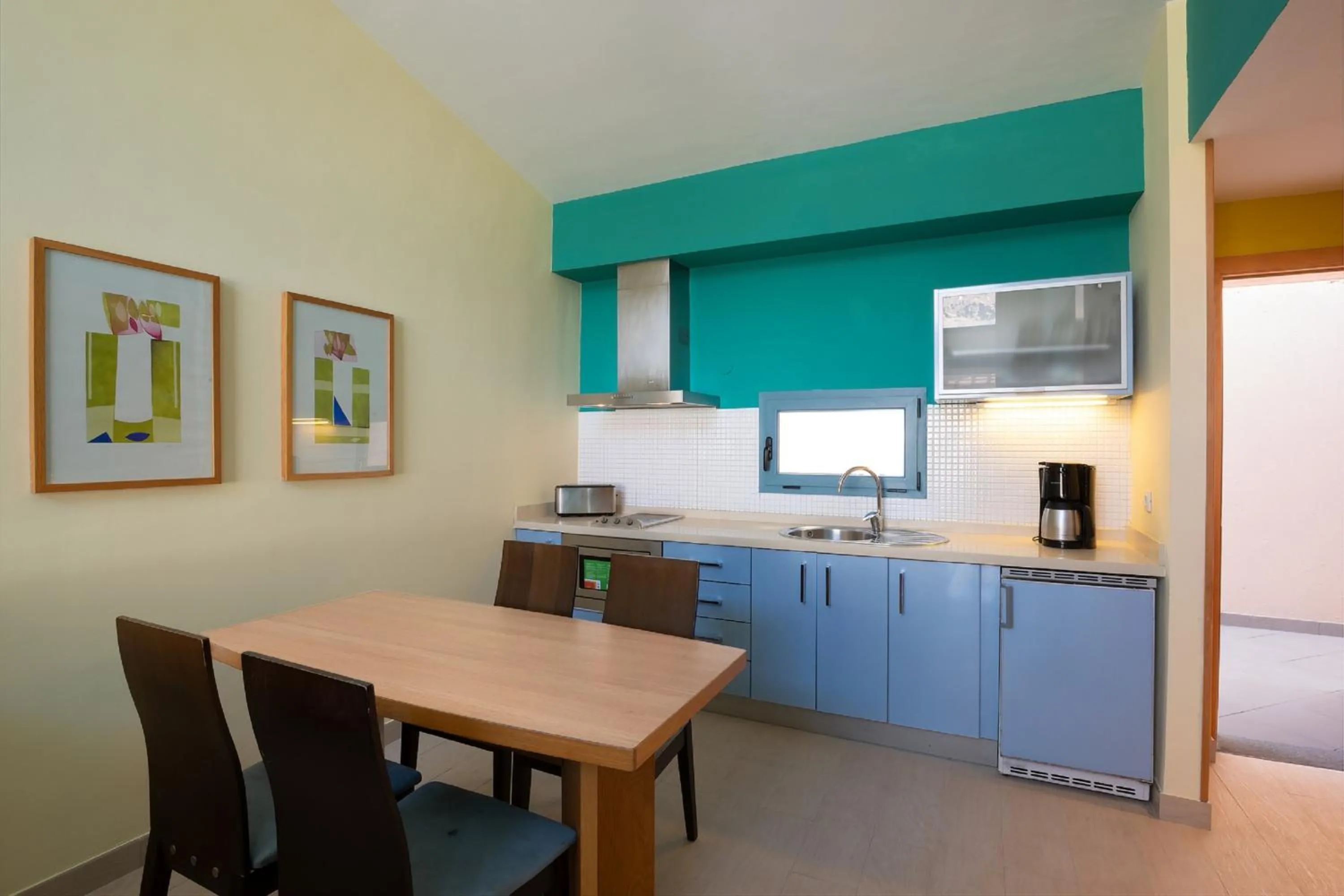 Kitchen or kitchenette in Apartamentos Cordial Mogán Valle