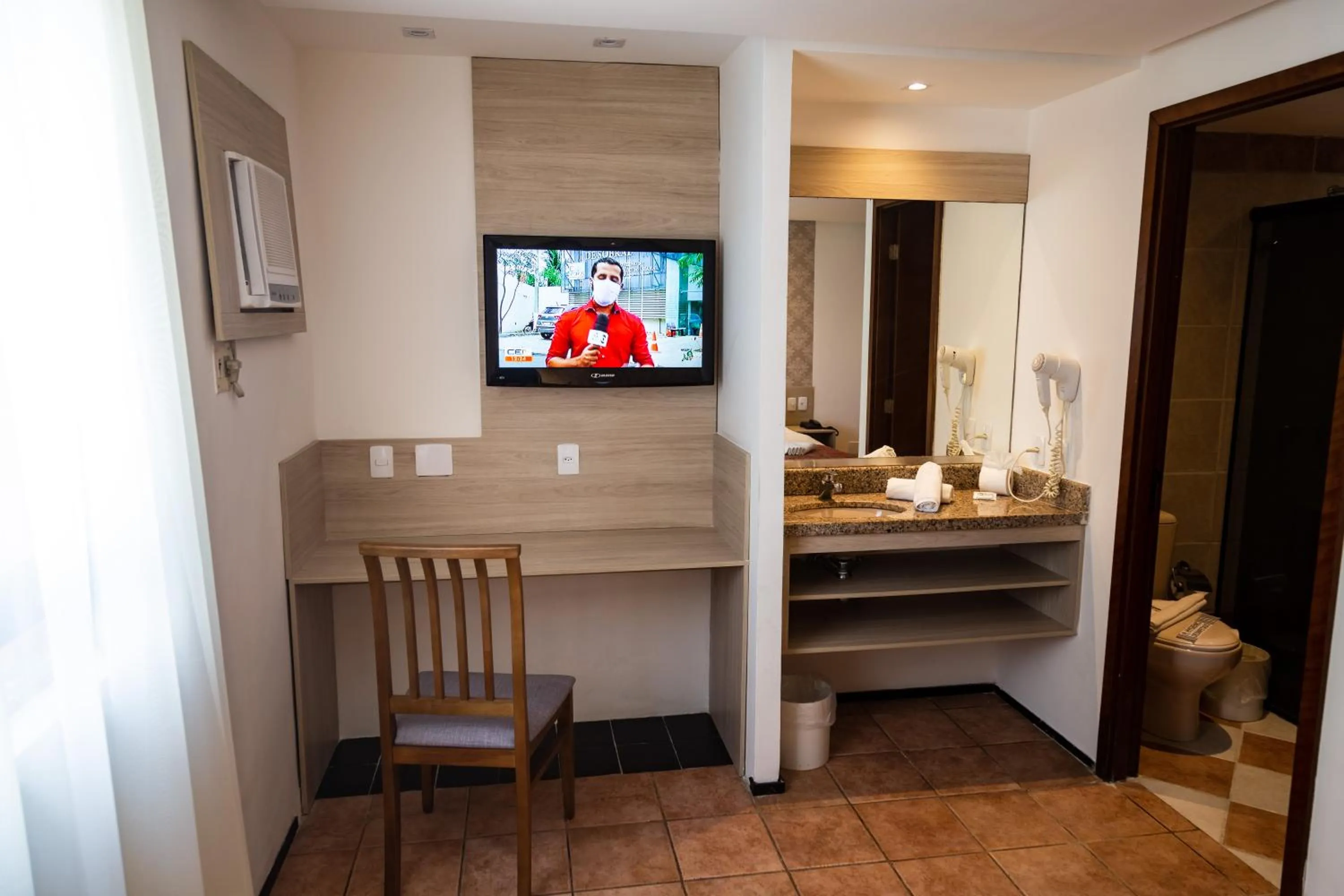 Bedroom in Plaza Praia Suítes