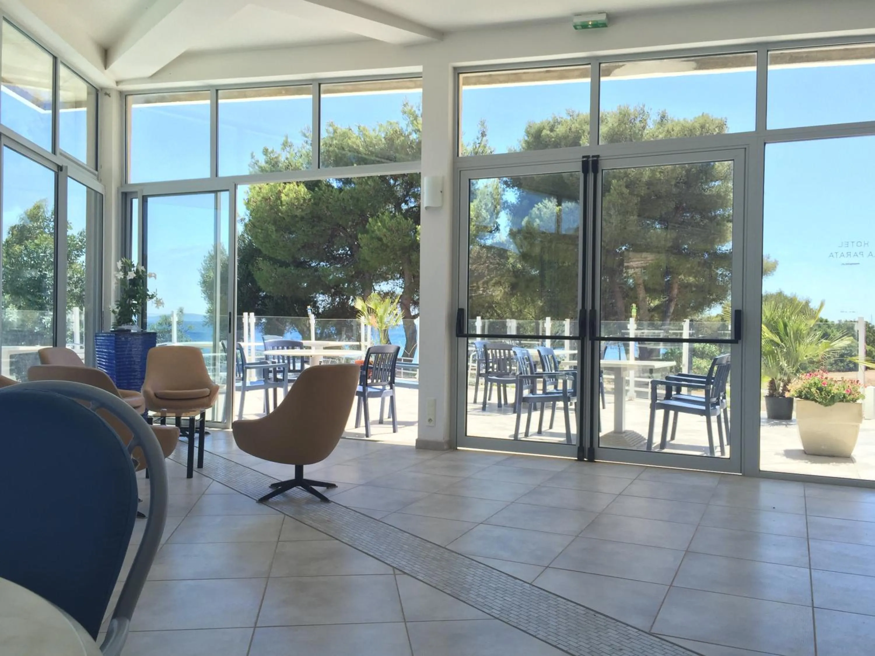 Communal lounge/ TV room in Hotel la Parata