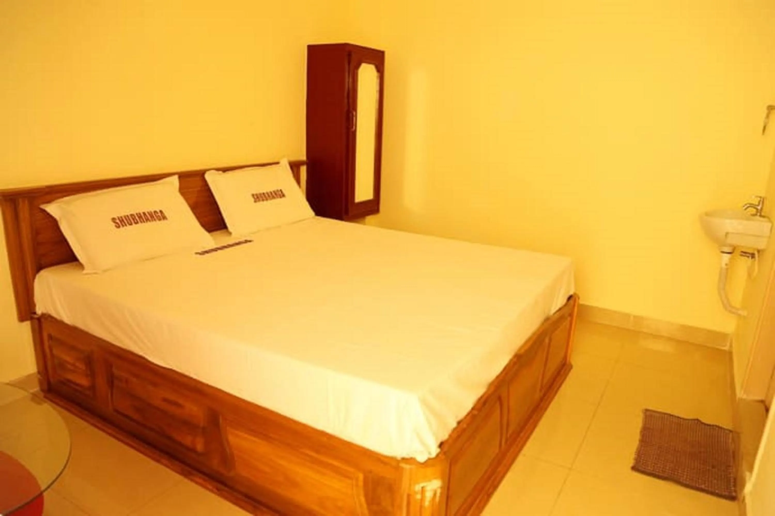 Photo of the whole room, Bed in Shubhanga Residency