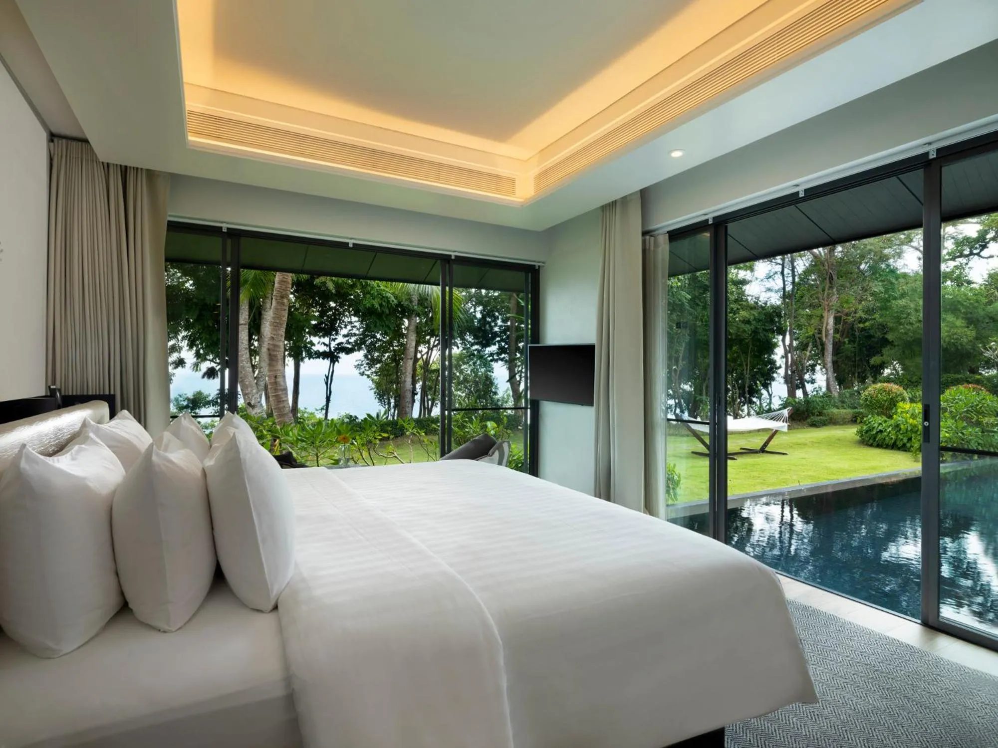 Bed in The ShellSea Krabi I Luxury Beach Front Resort & Pool Villa