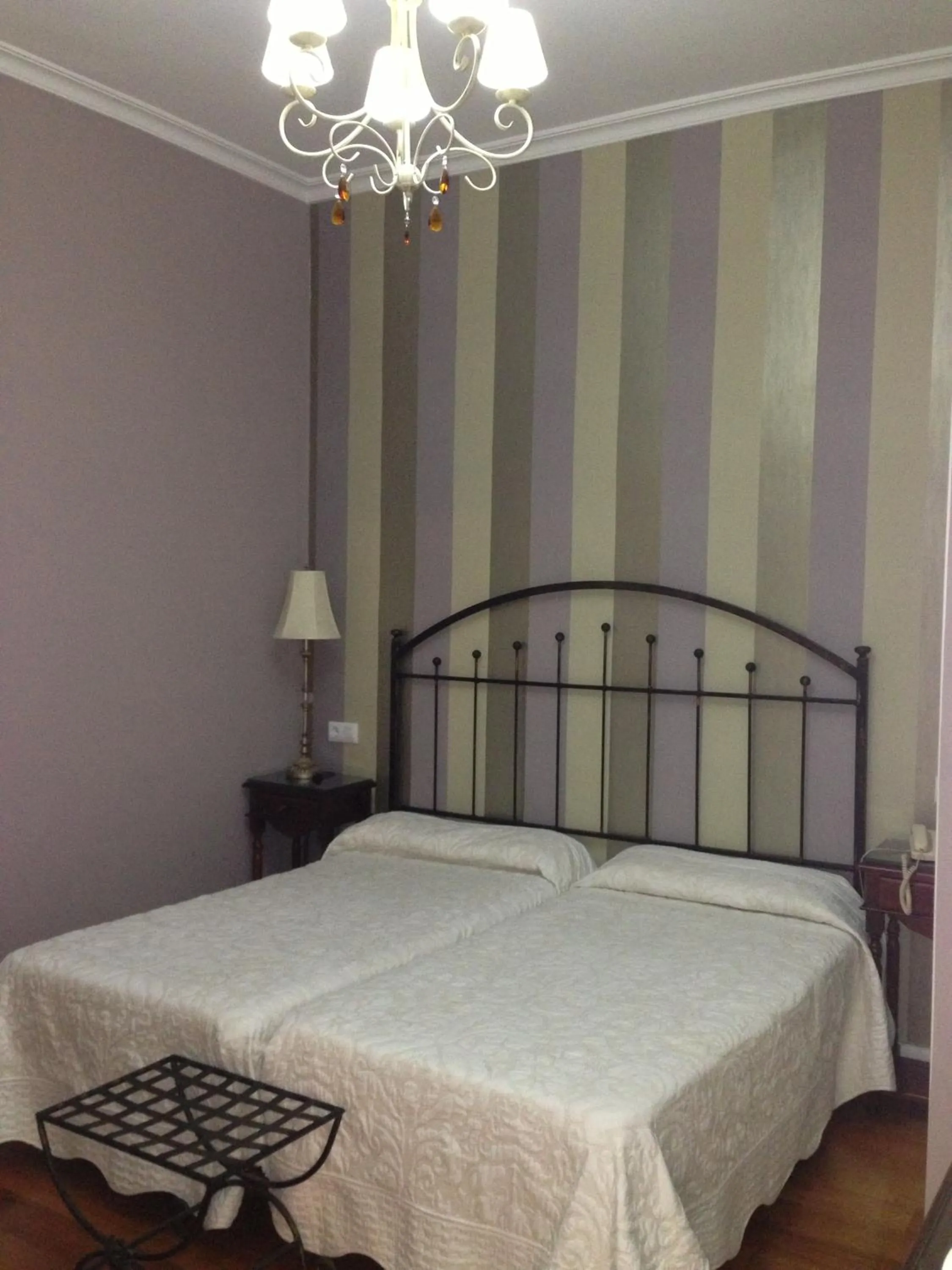 Photo of the whole room, Bed in Le Petit Paris