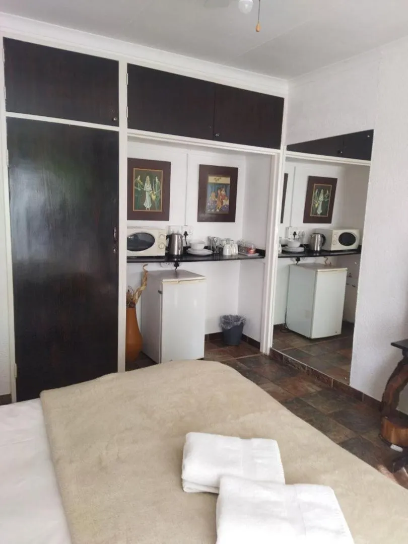 Bed in Ukarimu Guest House