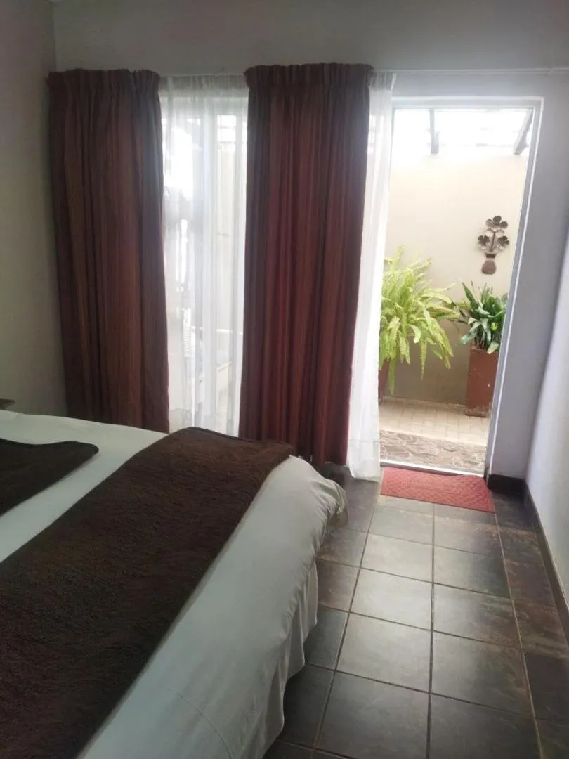 Bed in Ukarimu Guest House