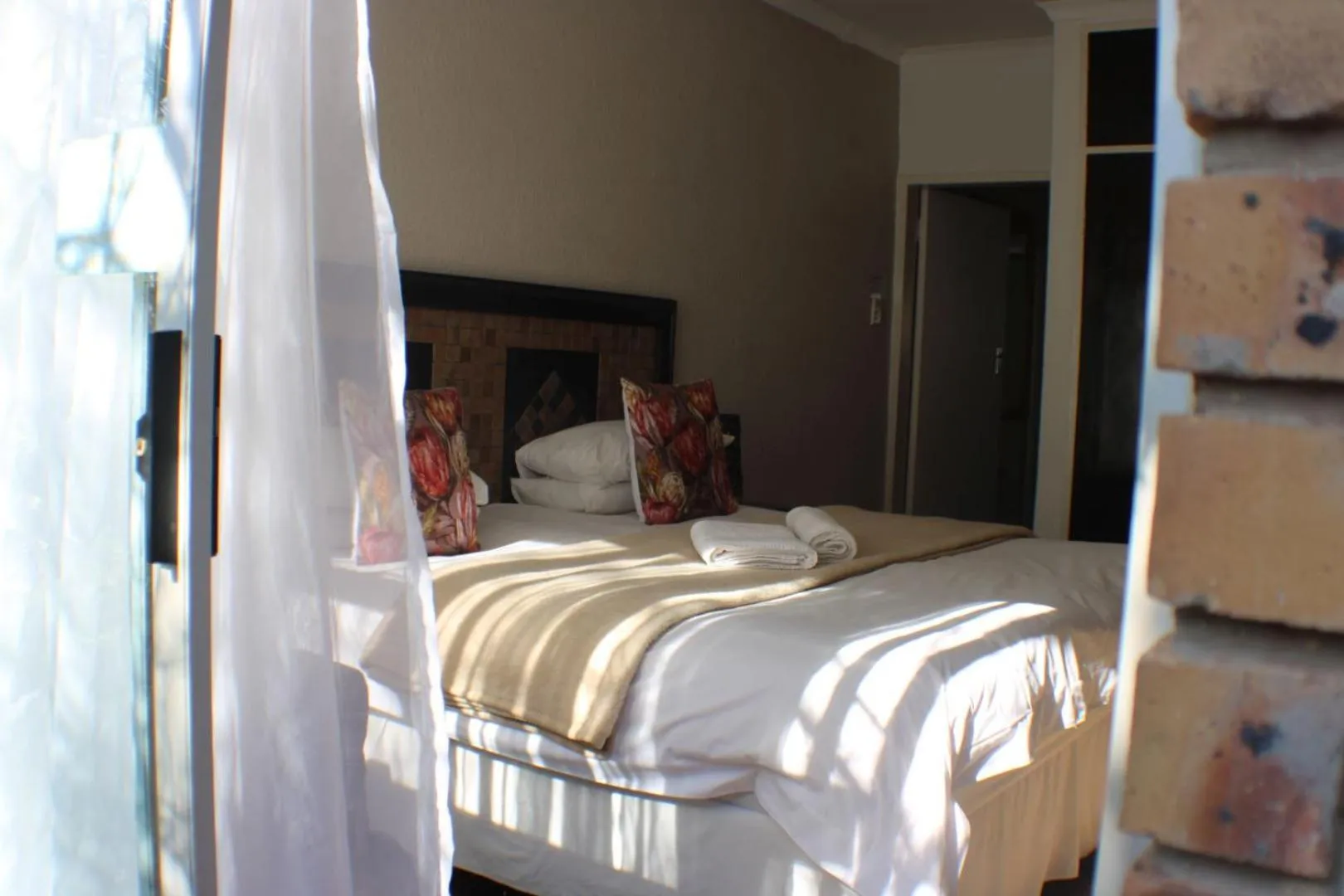 Bed in Ukarimu Guest House