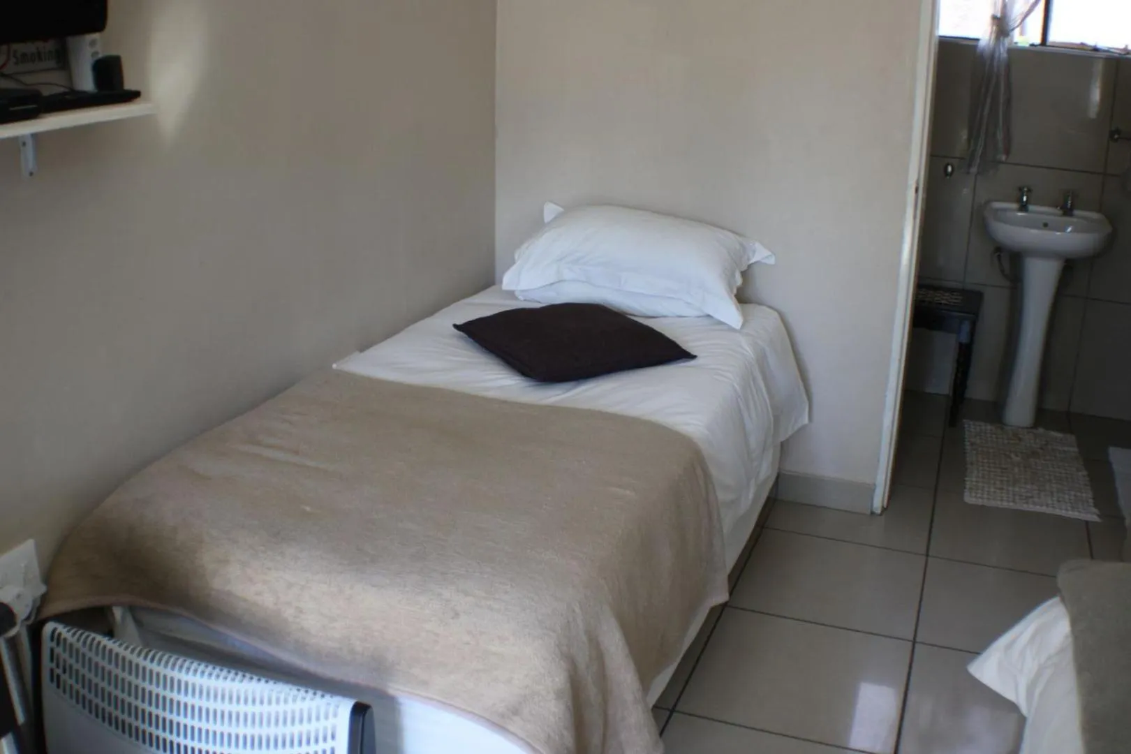 Bed in Ukarimu Guest House