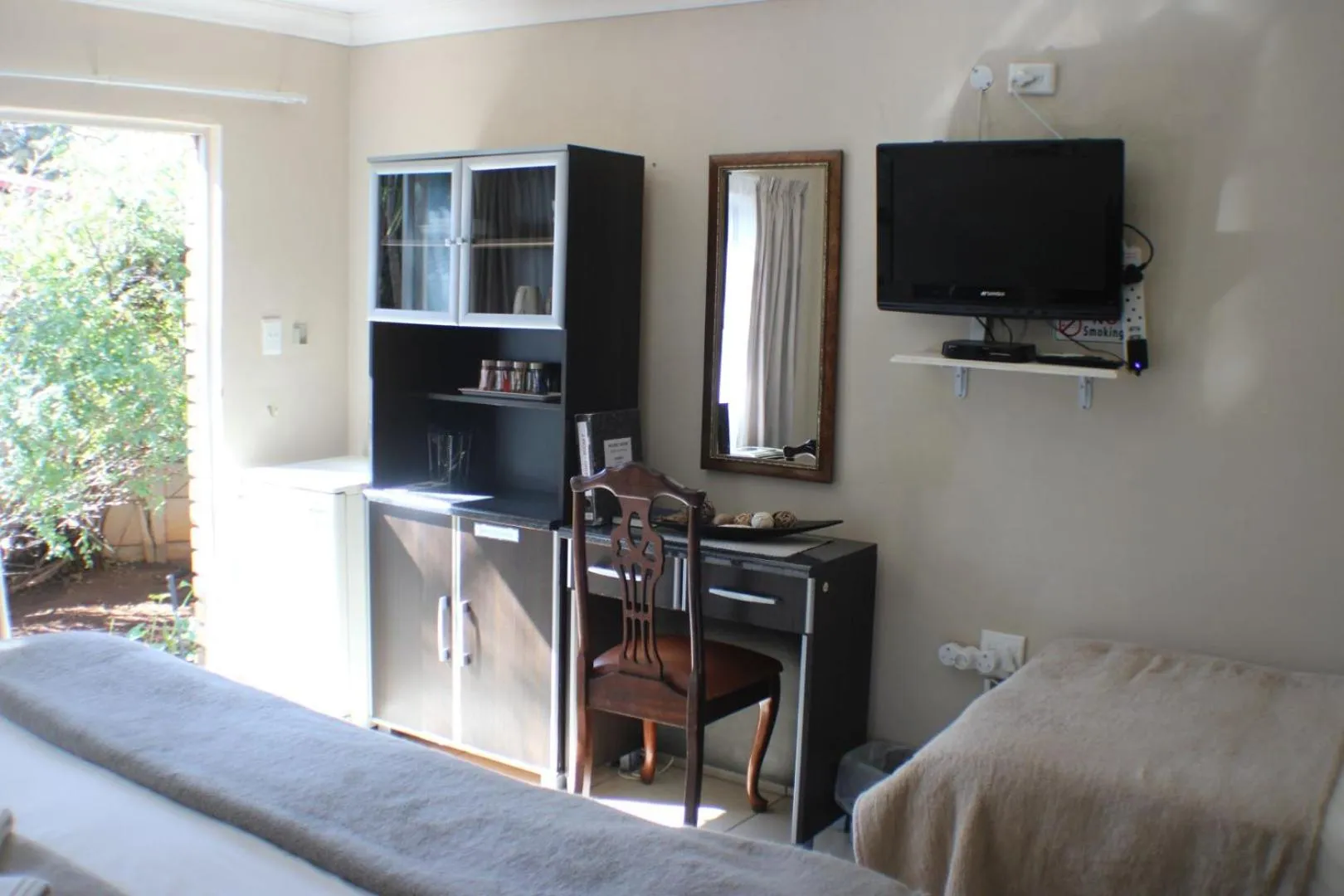 Bed in Ukarimu Guest House