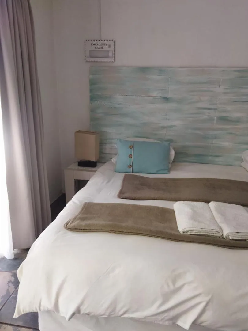 Bed in Ukarimu Guest House