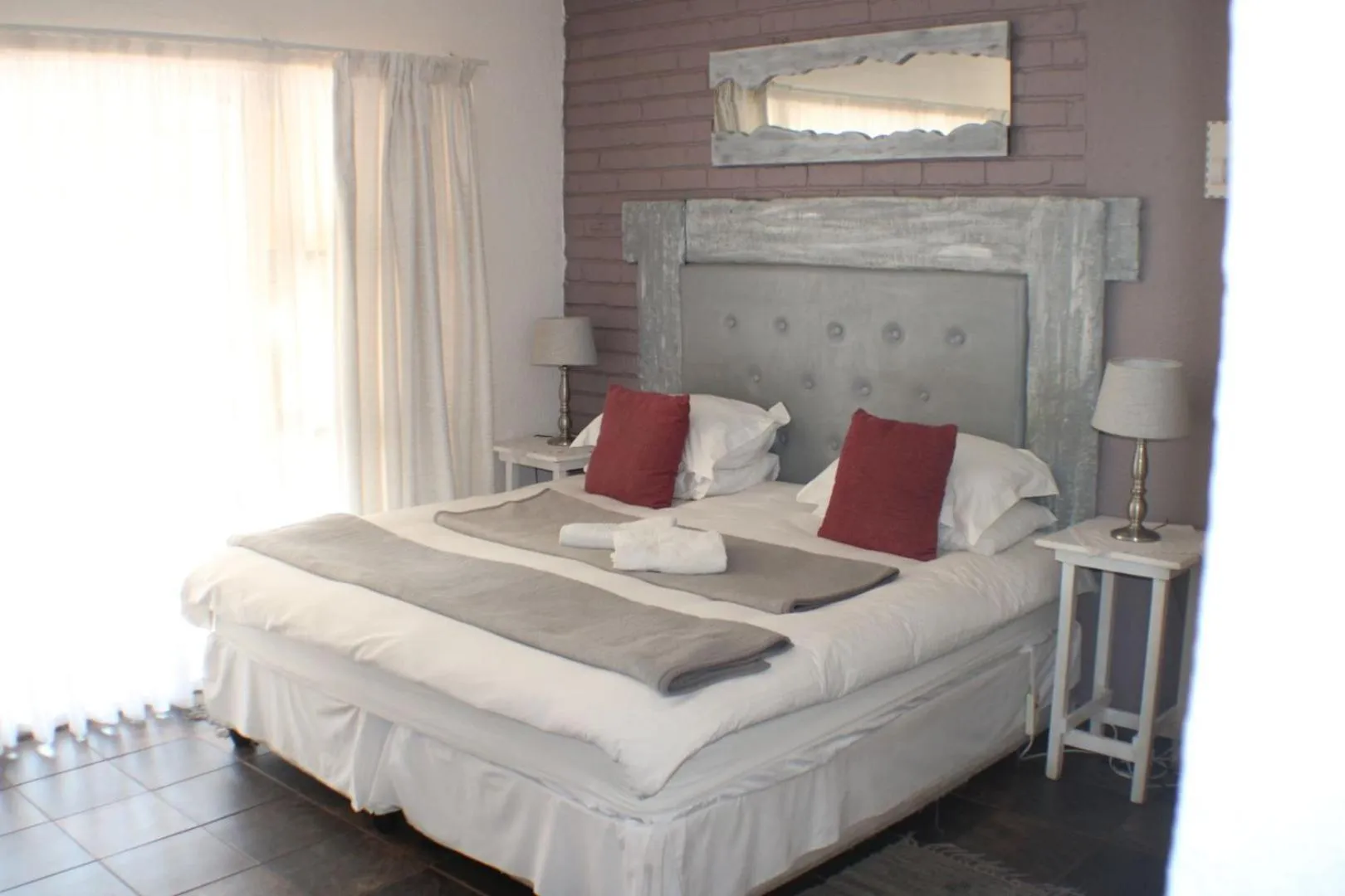 Bed in Ukarimu Guest House