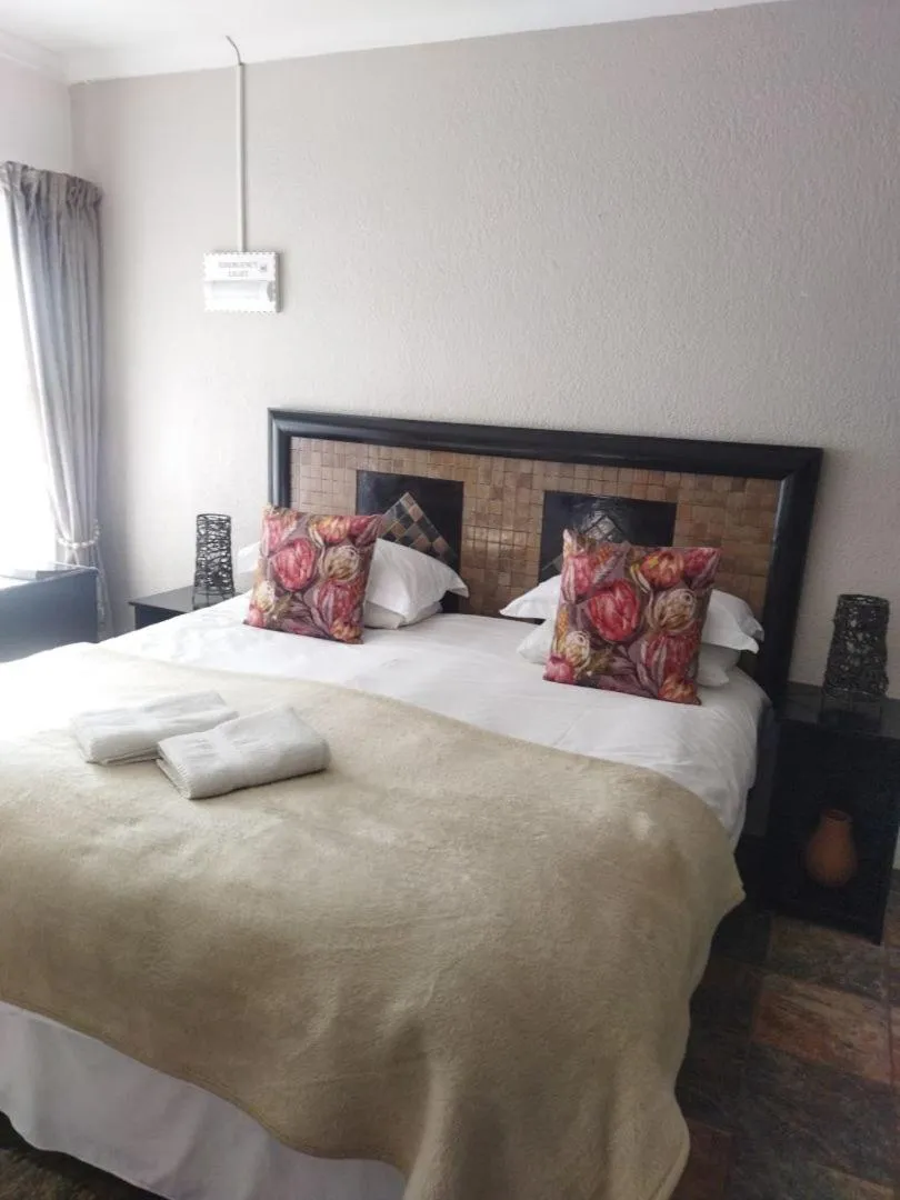 Bed in Ukarimu Guest House