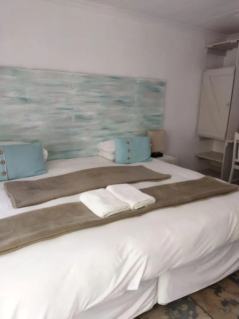 Bed in Ukarimu Guest House