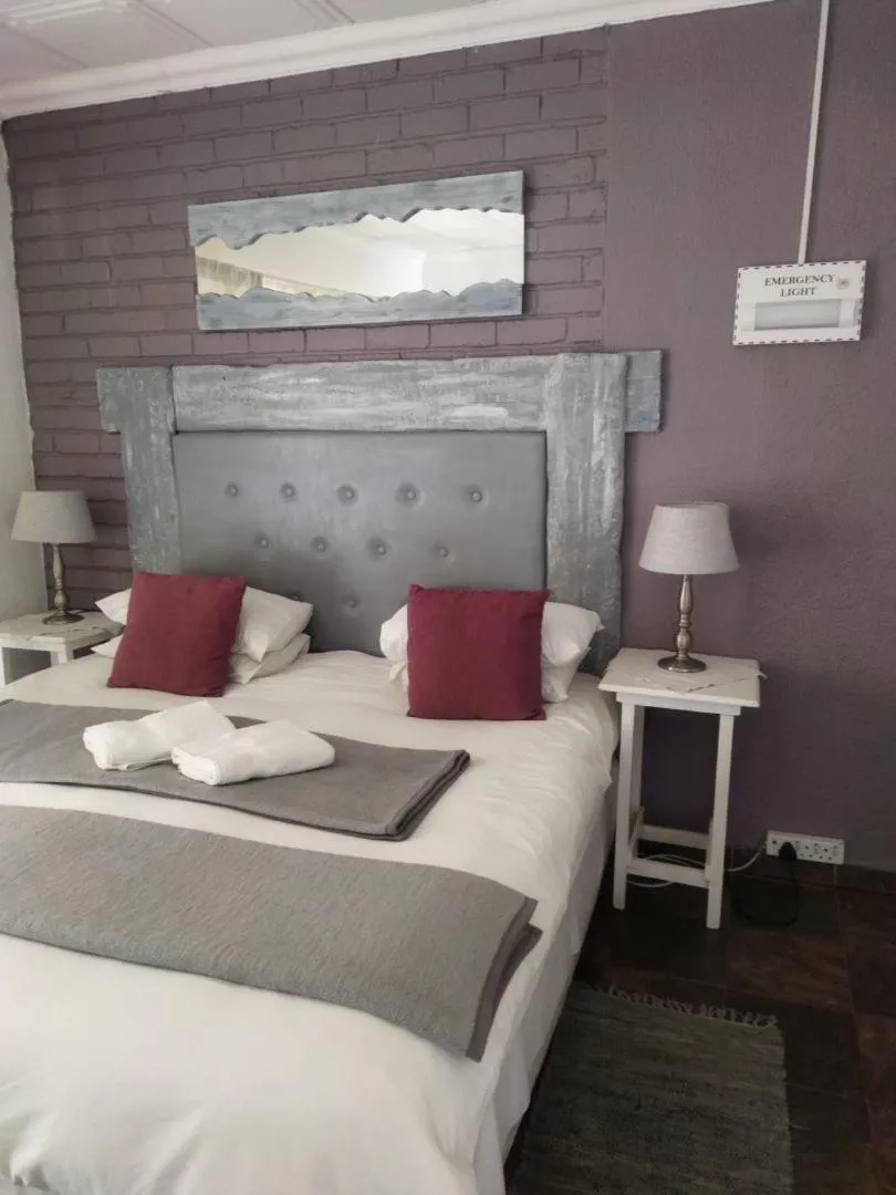 Bed in Ukarimu Guest House