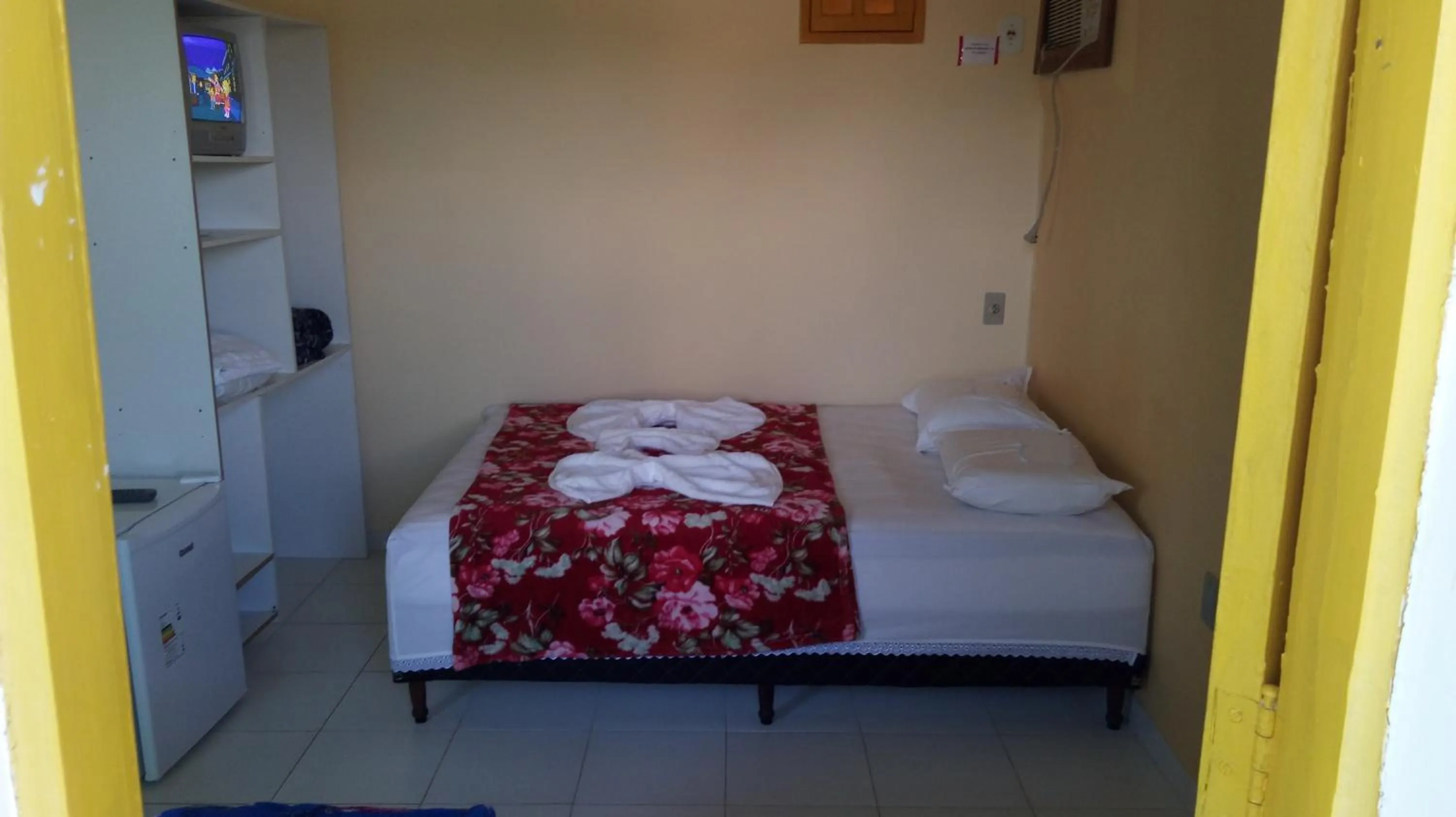 Bed in Encantos Pousada